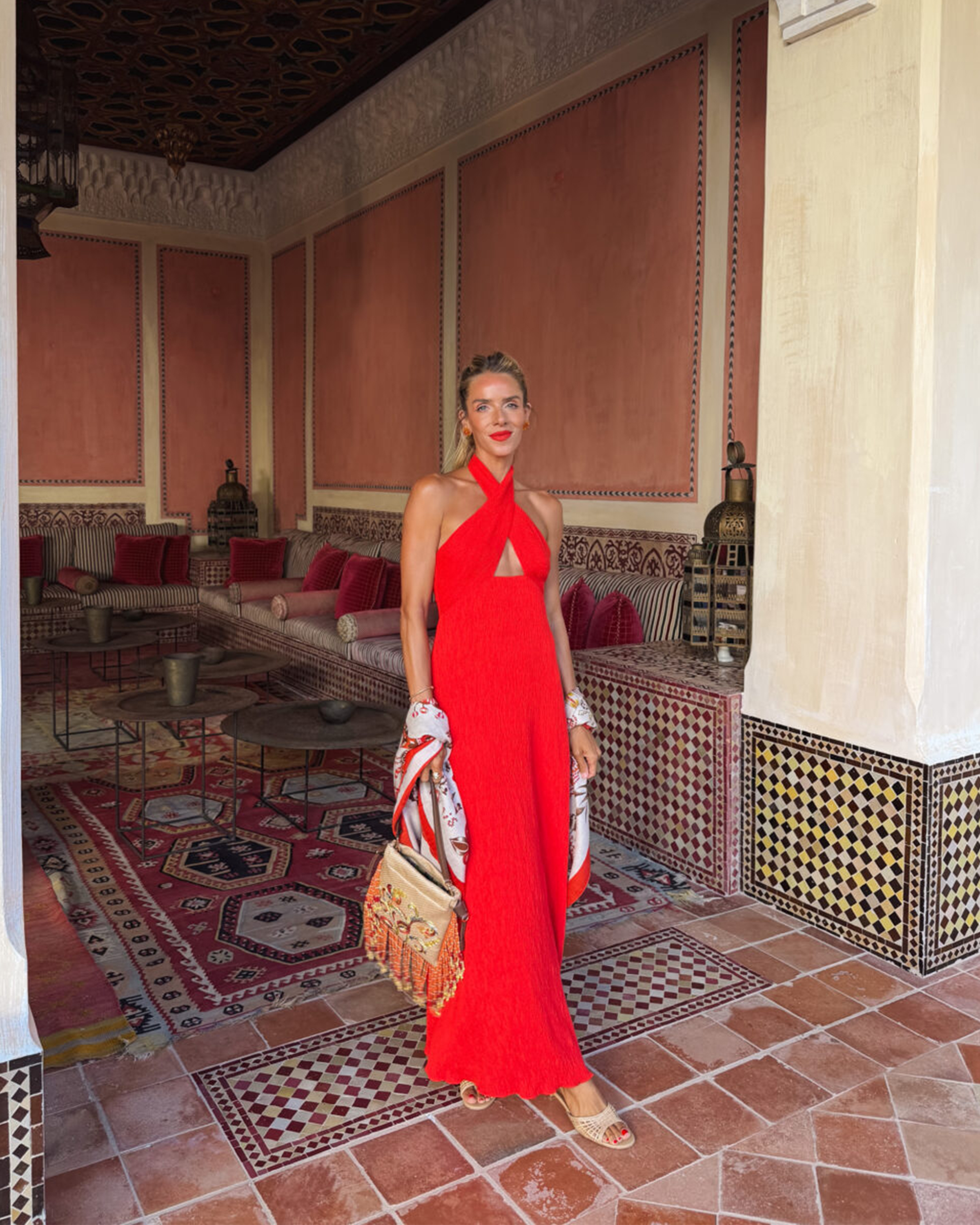 One of a kind carved Fire Opal Tropical Flower Earrings lend a warm glow to Julia's striking evening look.