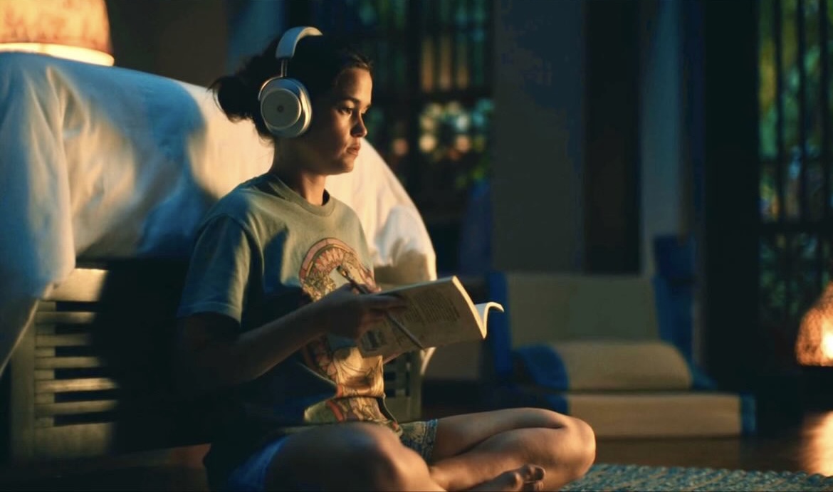 Piper uses the headphones to listen to Buddhist teachings