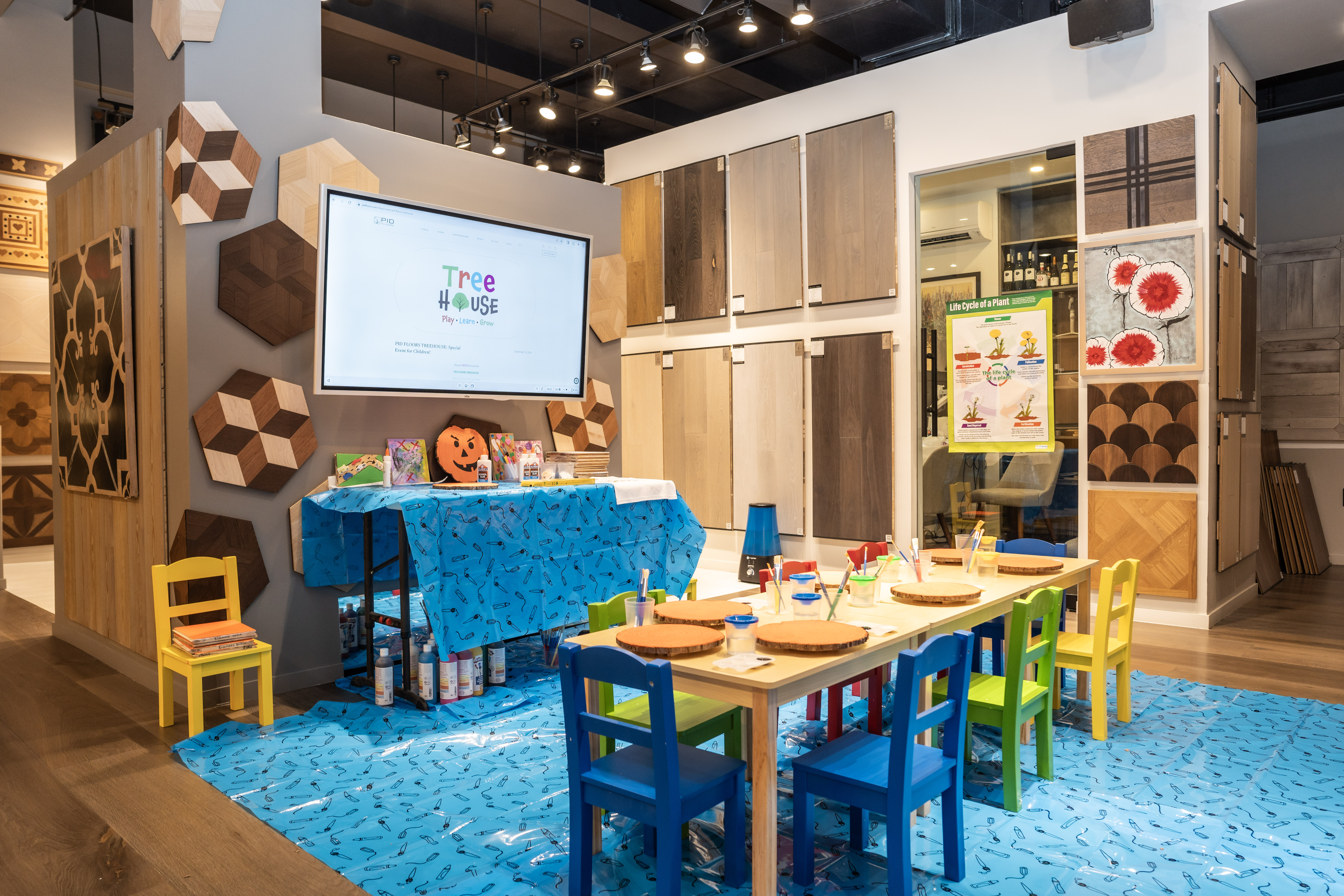 Luxury flooring displays with Halloween decorations at TREE HOUSE showroom