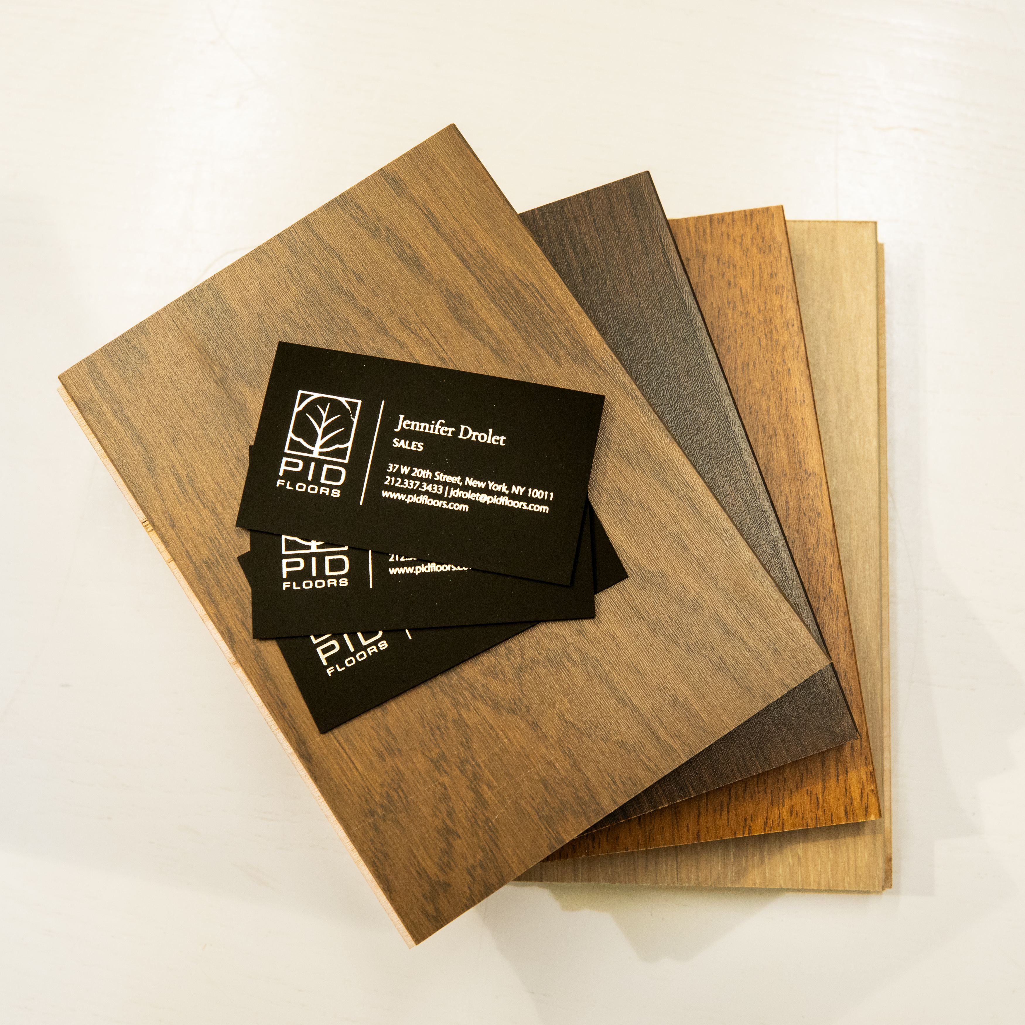 Close up of luxury hardwood samples by PID Floors displayed at MKDA event