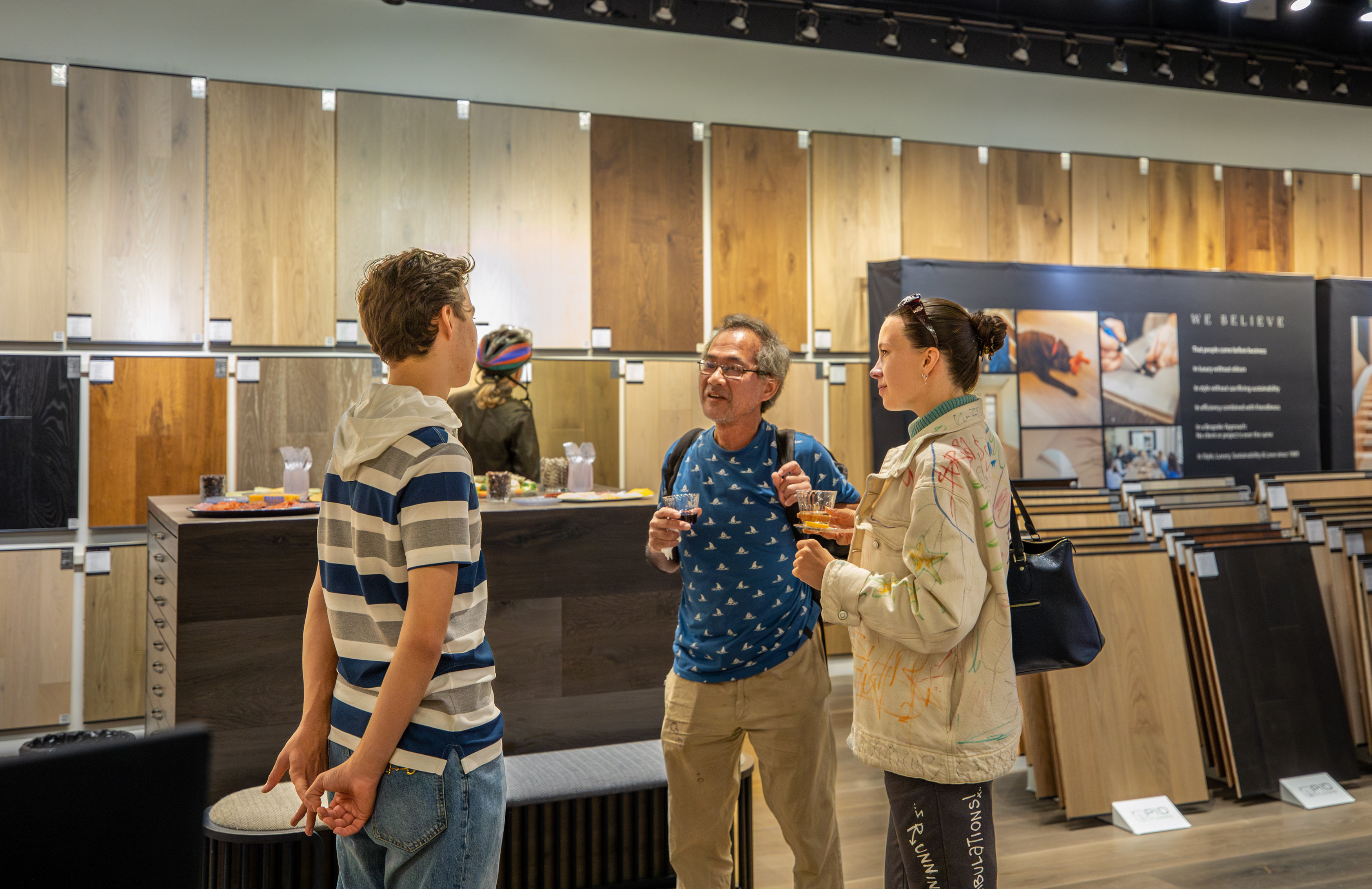 Attendees examining luxury tile and flooring combinations at design tour