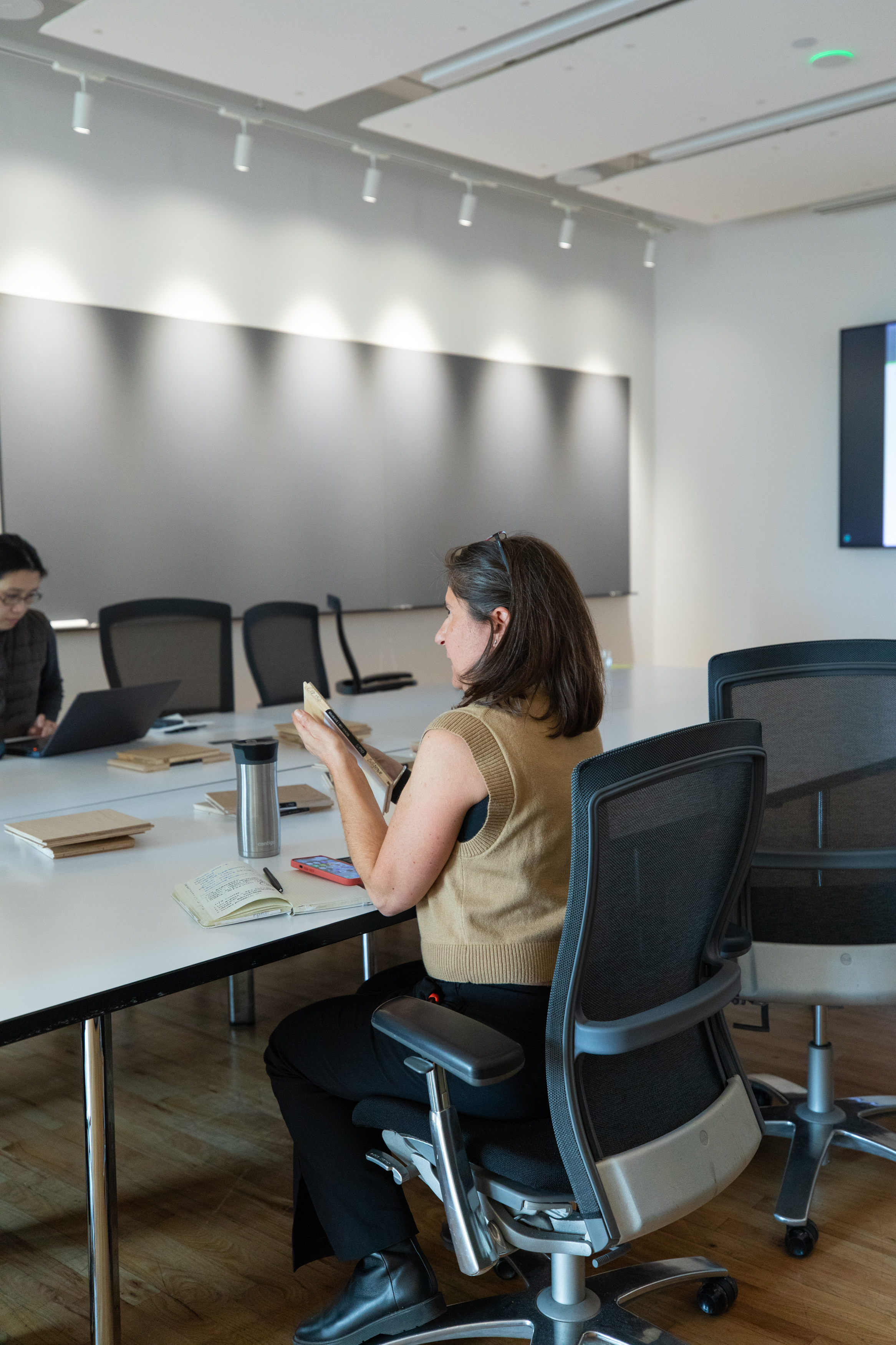 Attendees examining flooring samples during Studios Architecture Lunch and Learn