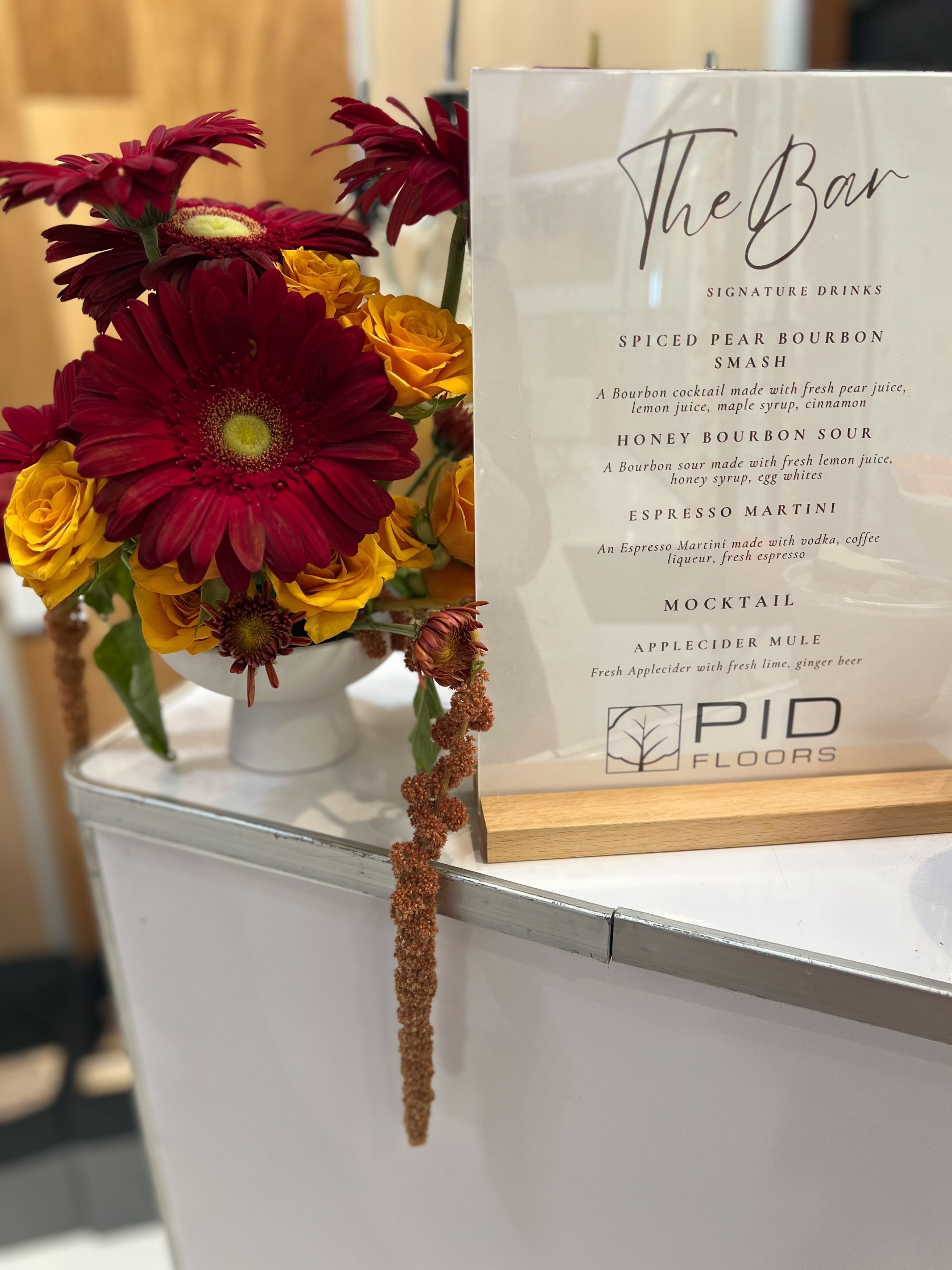 Premium luxury flooring material close-up showing texture and craftsmanship at PID Floors South Florida Design Park showroom Fall Market 2025