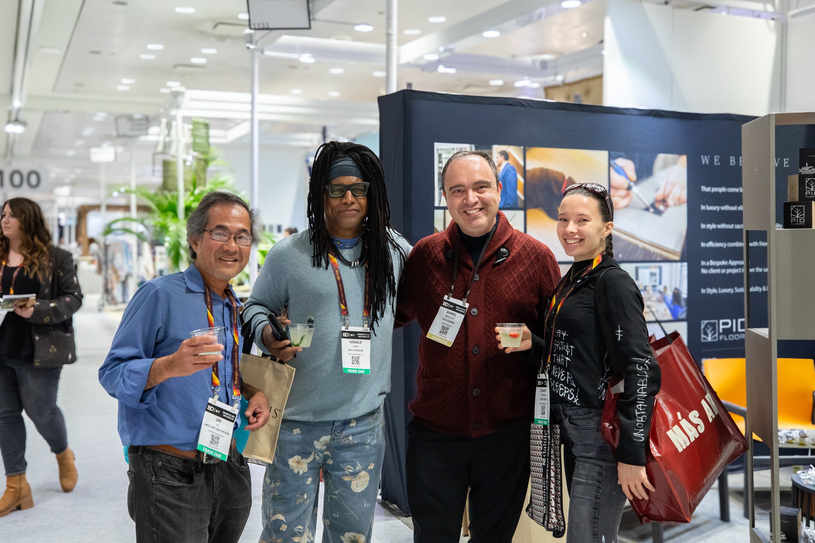 Hospitality designers consulting with PID Floors experts at BDNY 2025 about luxury flooring solutions for boutique hotel projects
