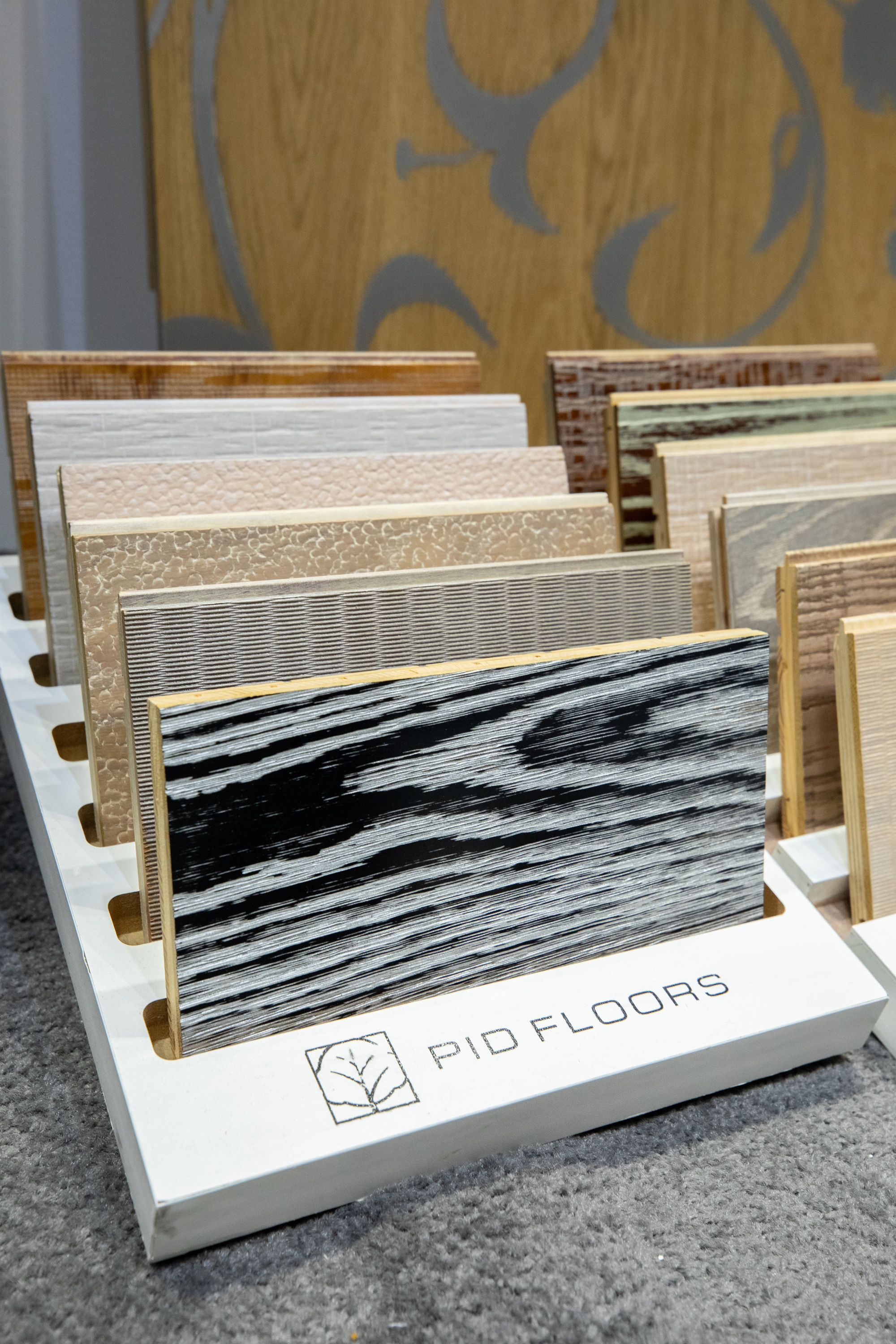 Designer flooring vignette at PID Floors BDNY 2025 display featuring premium surfaces in contemporary hospitality interior concept