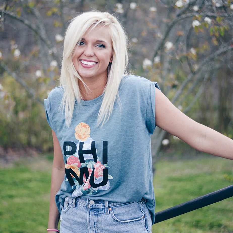 girl wearing a pi phi ash gray sweatshirt