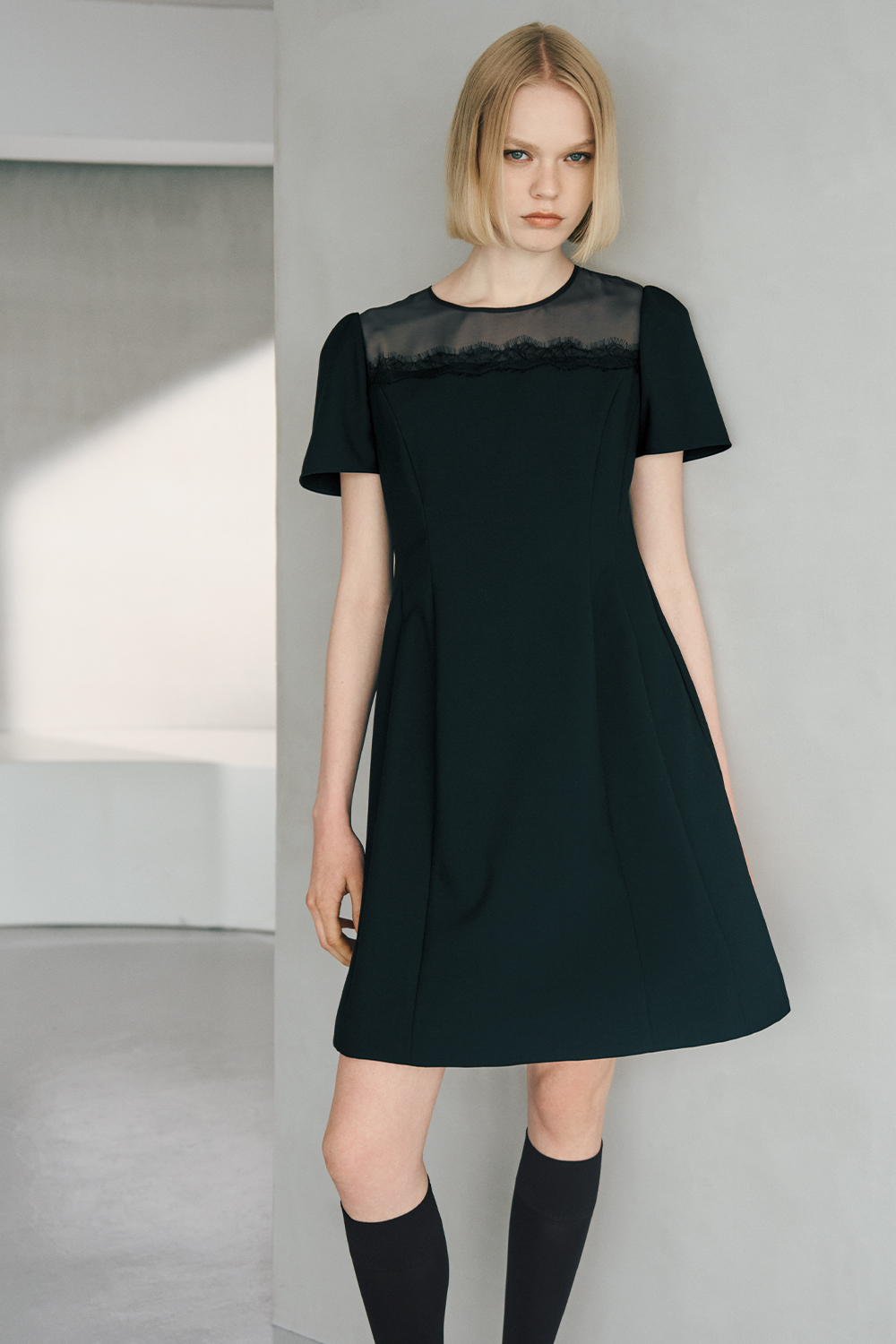 The model is wearing a black dress.