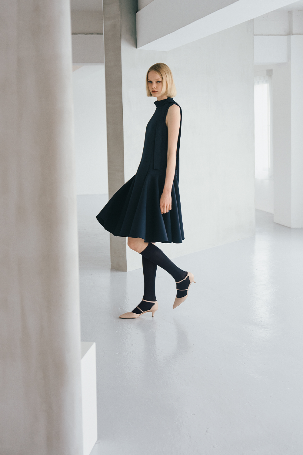 The model is wearing a black dress.