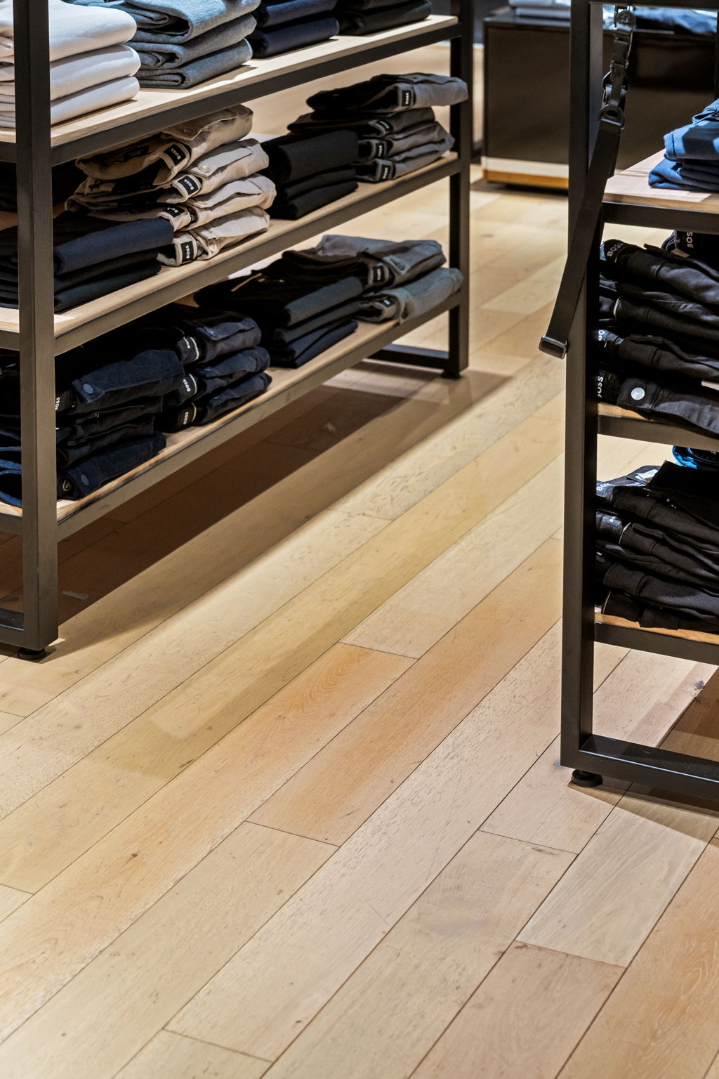 Close-up European oak plank flooring craftsmanship PID Floors Hugo Boss Miami designer menswear showroom