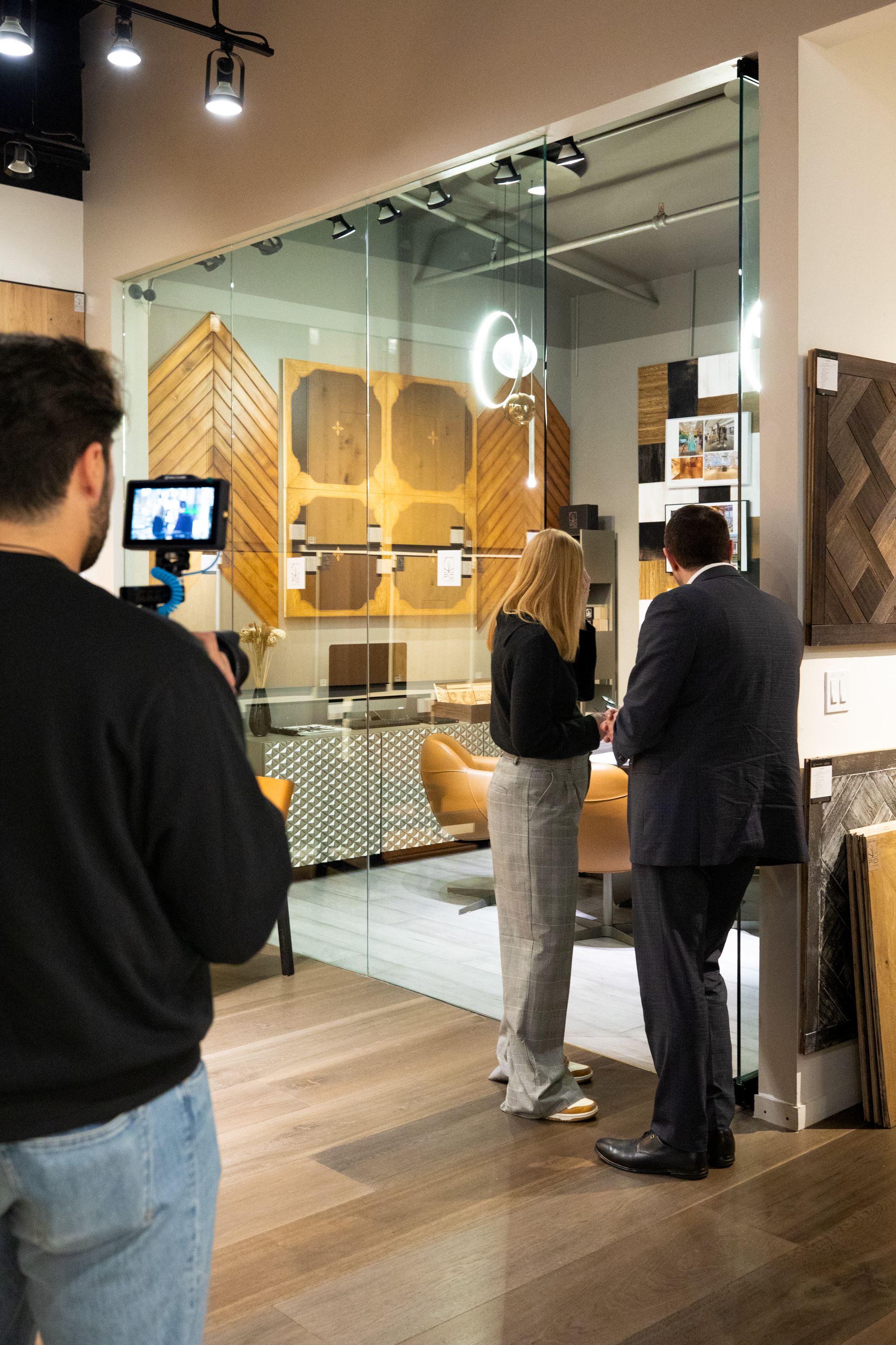 PID Floors interview setting with hardwood floor samples and showroom backdrop