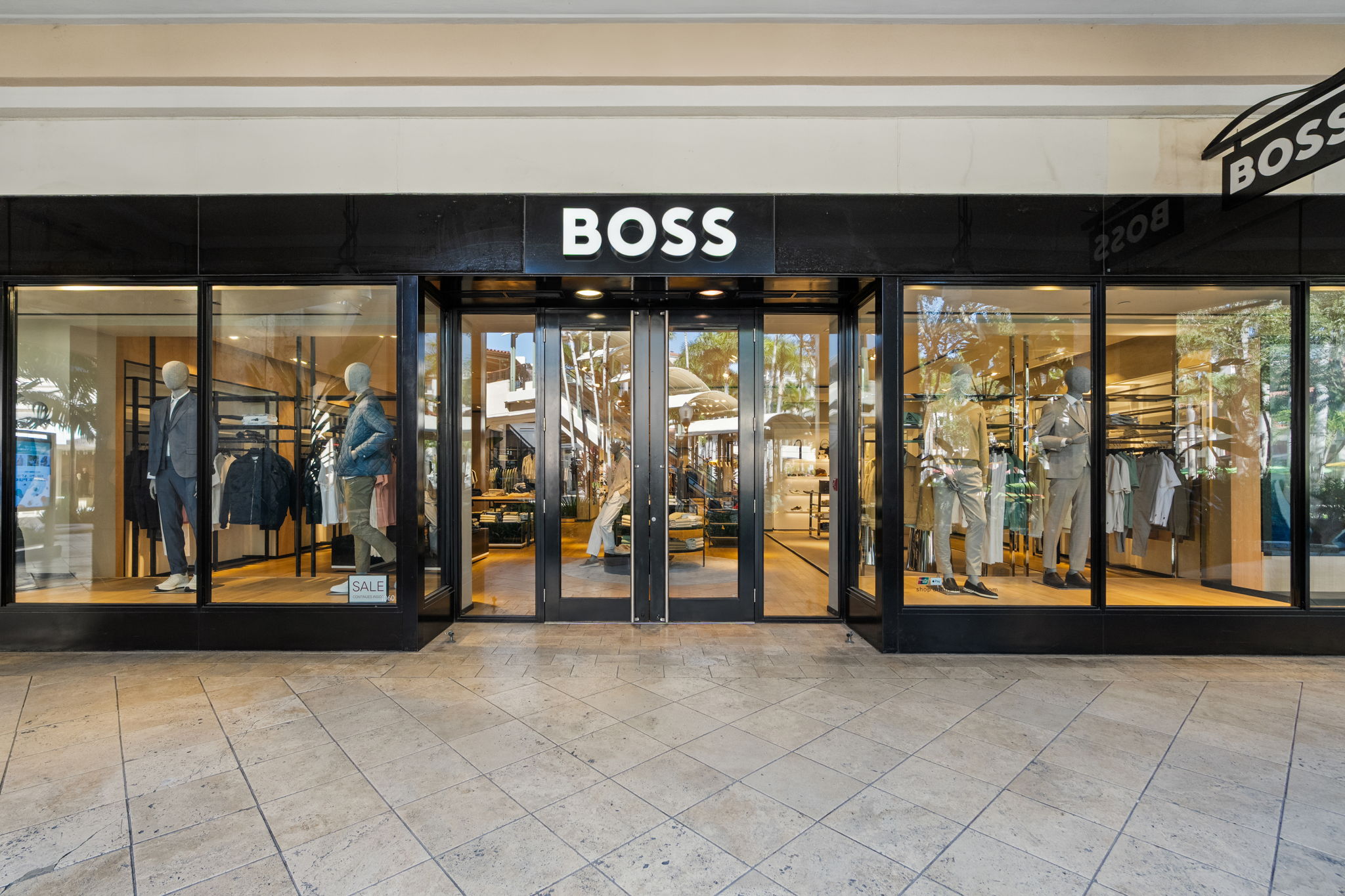 Signature hardwood floors installed by PID Floors Hugo Boss Coral Gables refined menswear boutique space