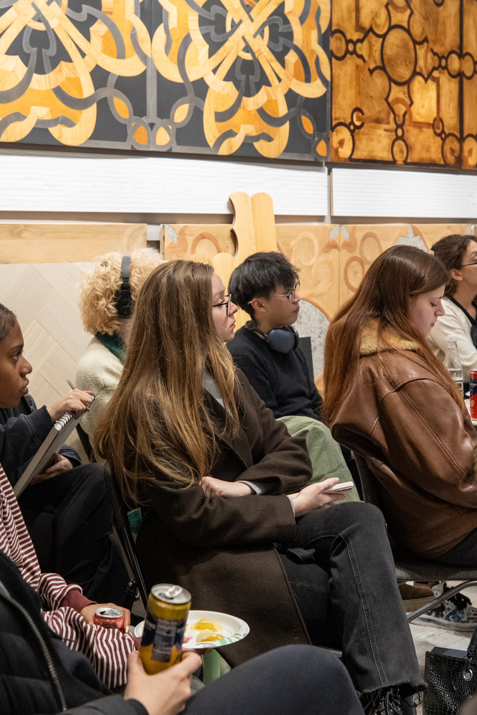 FIT students touching and comparing premium wood floor textures at PID Floors showroom