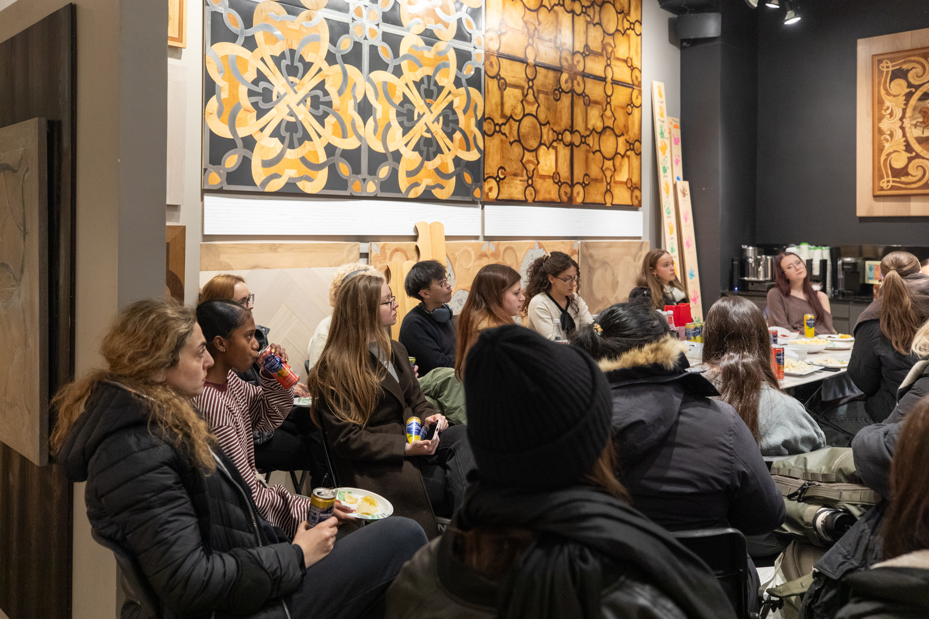 FIT students examining wide-plank hardwood flooring samples at PID Floors New York City