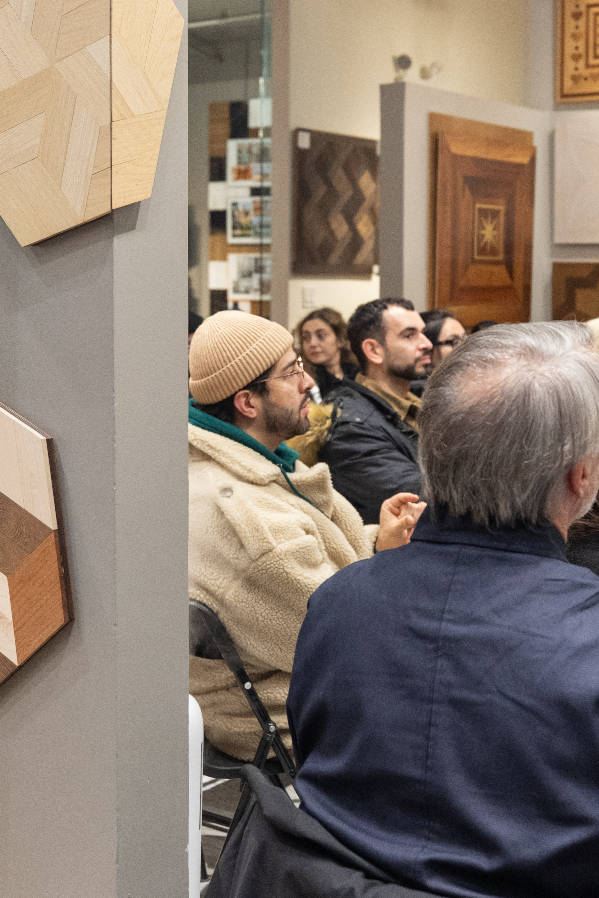 FIT design students taking notes during presentation at PID Floors NYC flagship