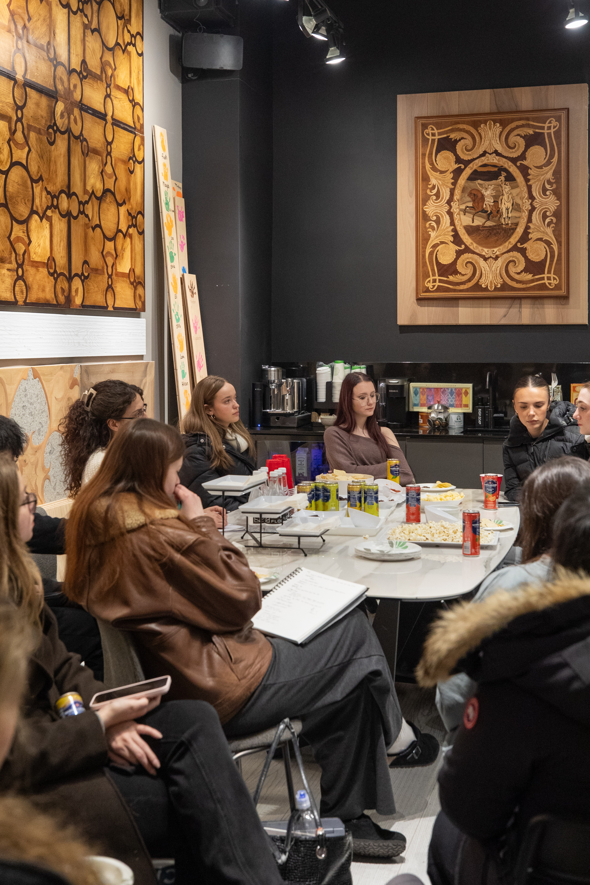 PID Floors team welcoming FIT design students to luxury hardwood flooring showroom