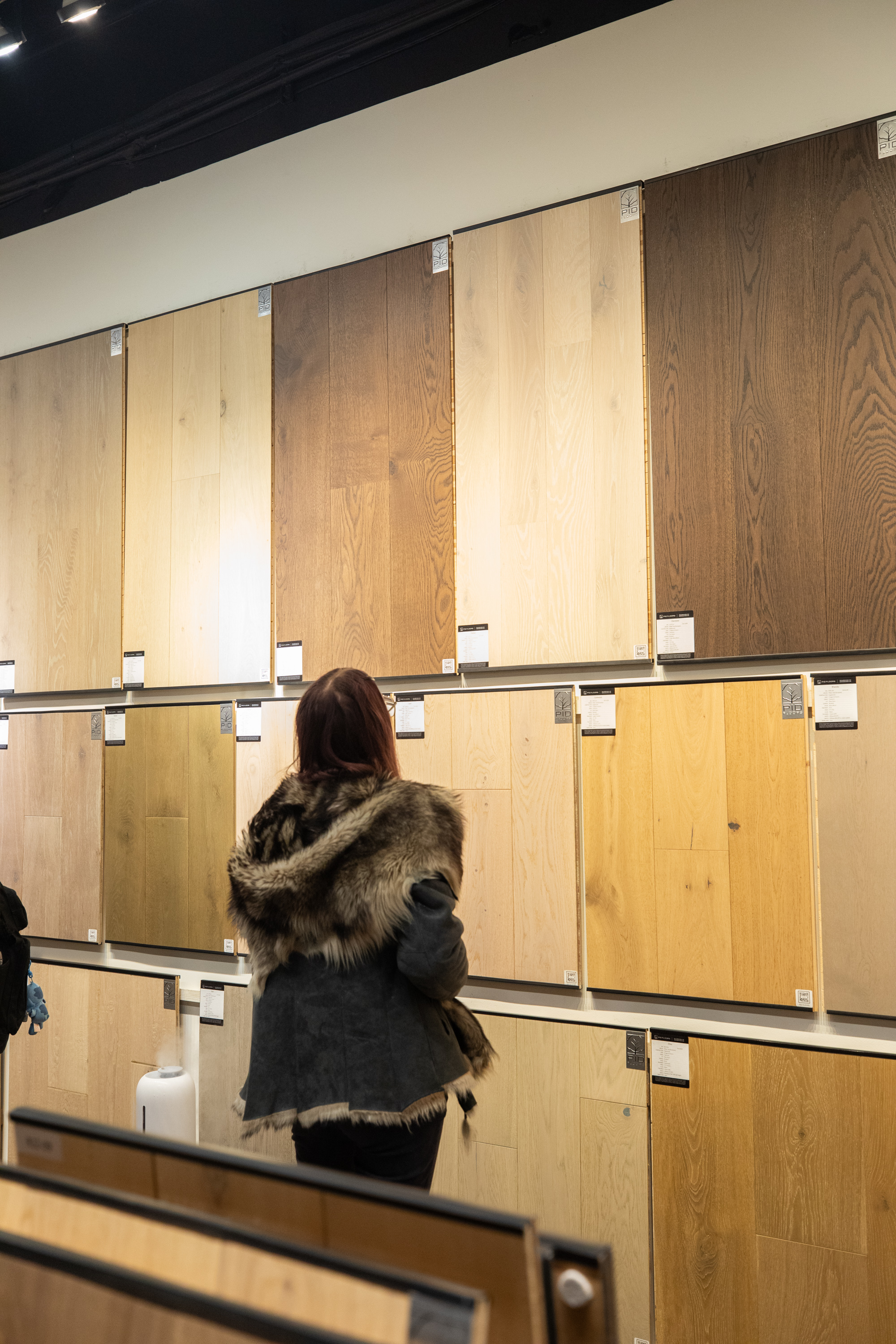 Interior shot of PID Floors NYC showroom with FIT students exploring flooring collections