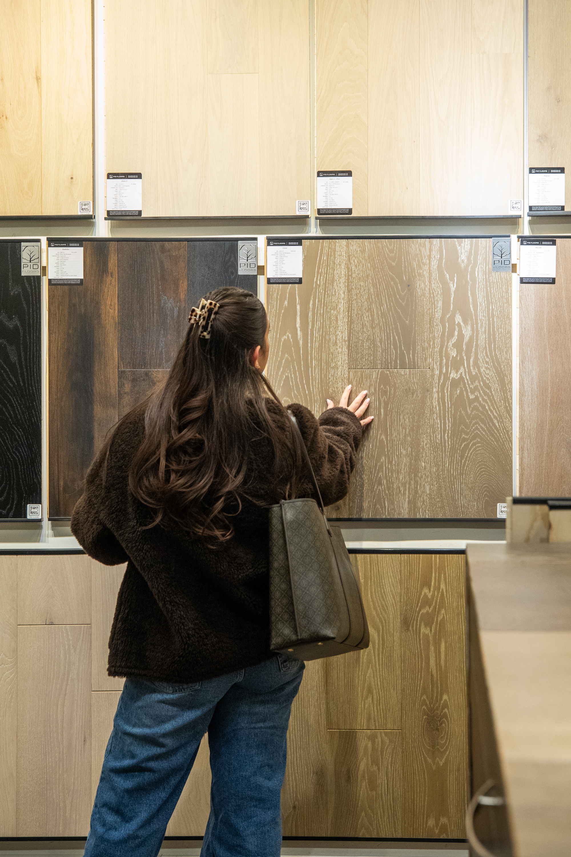 Close detail of hand-scraped hardwood flooring shown during PID Floors FIT tour