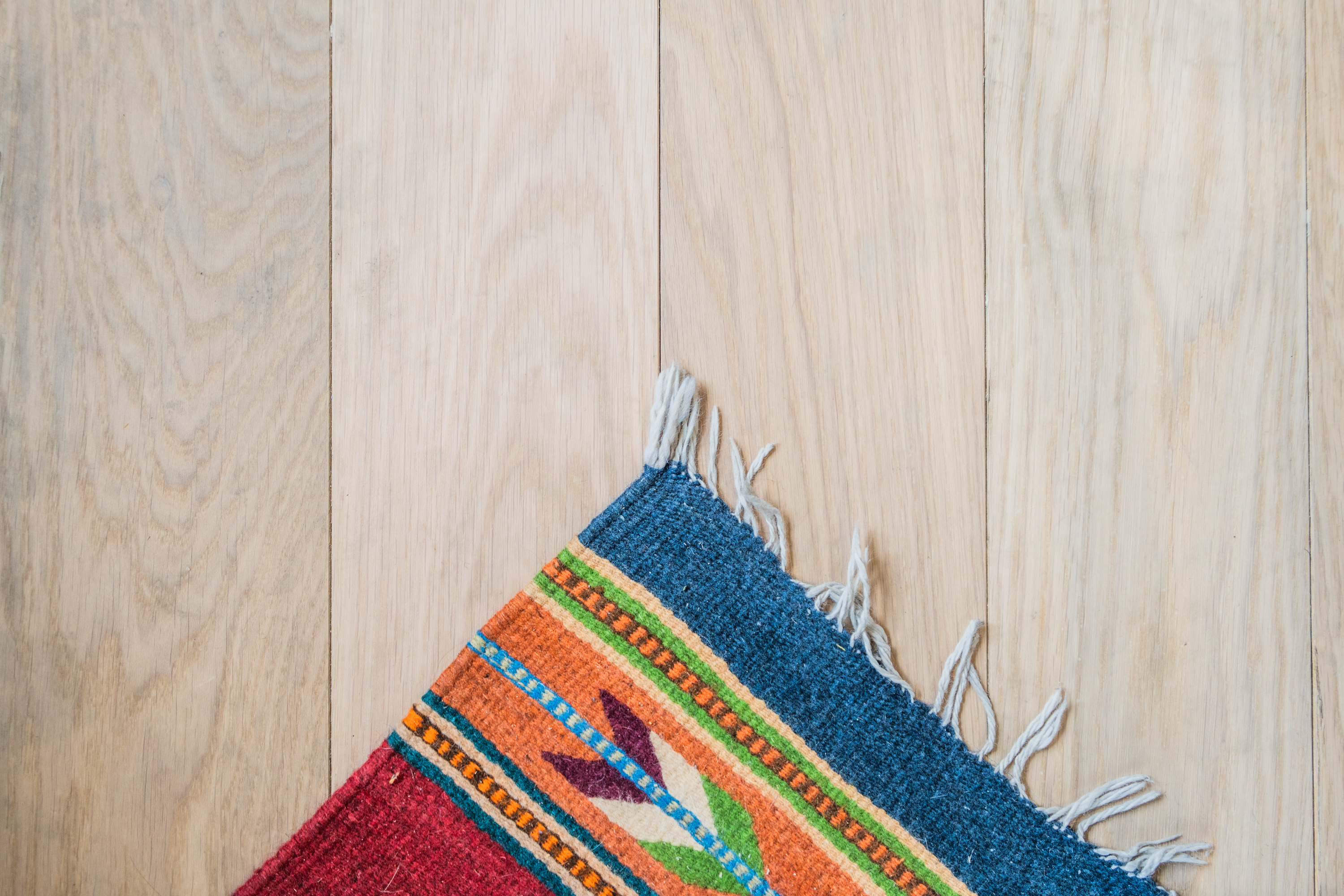 Close-up PID Floors custom floor design enhancing 210 East Broadway living space