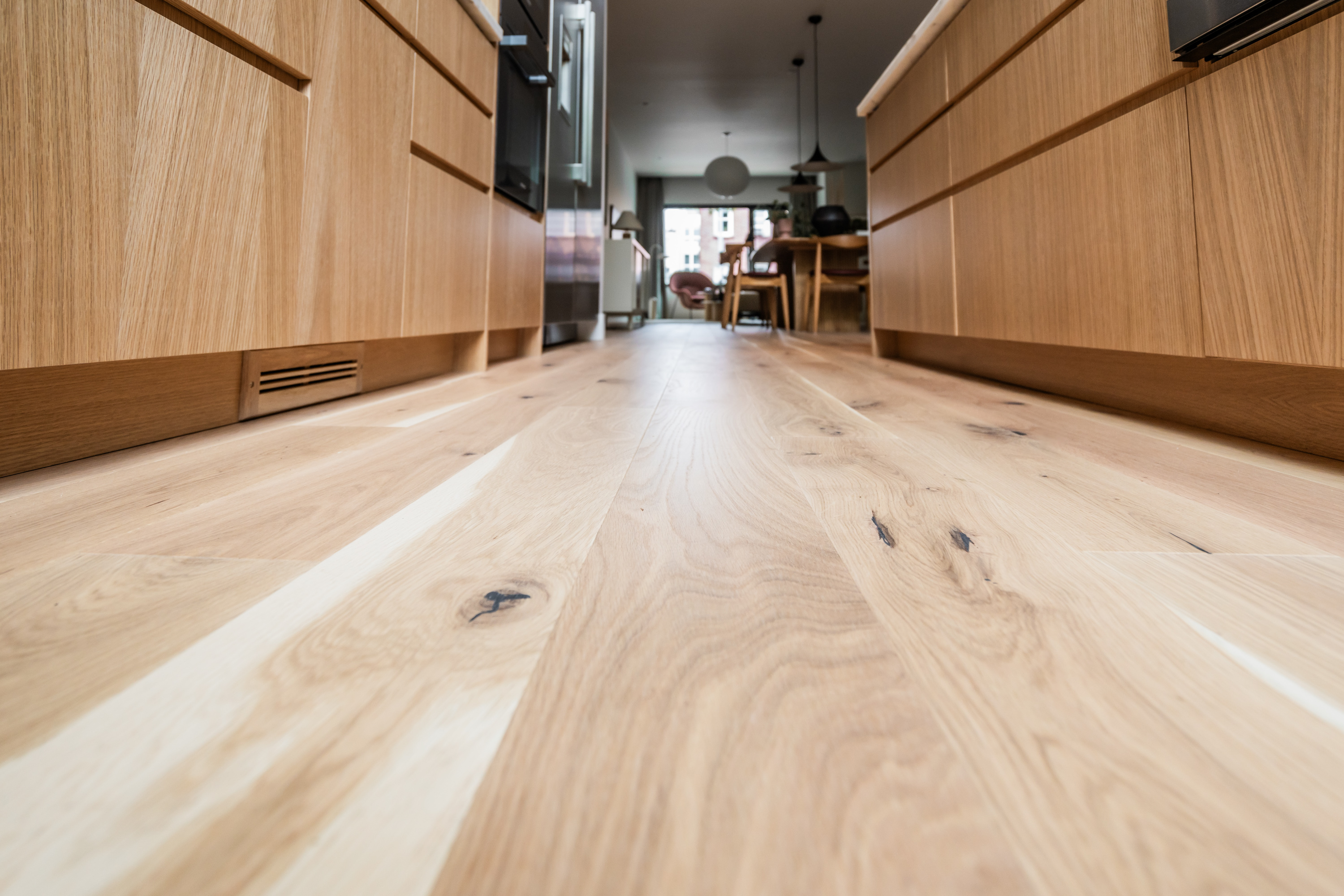 Java Haus project PID Floors premium wood floor installation close-up grain detail