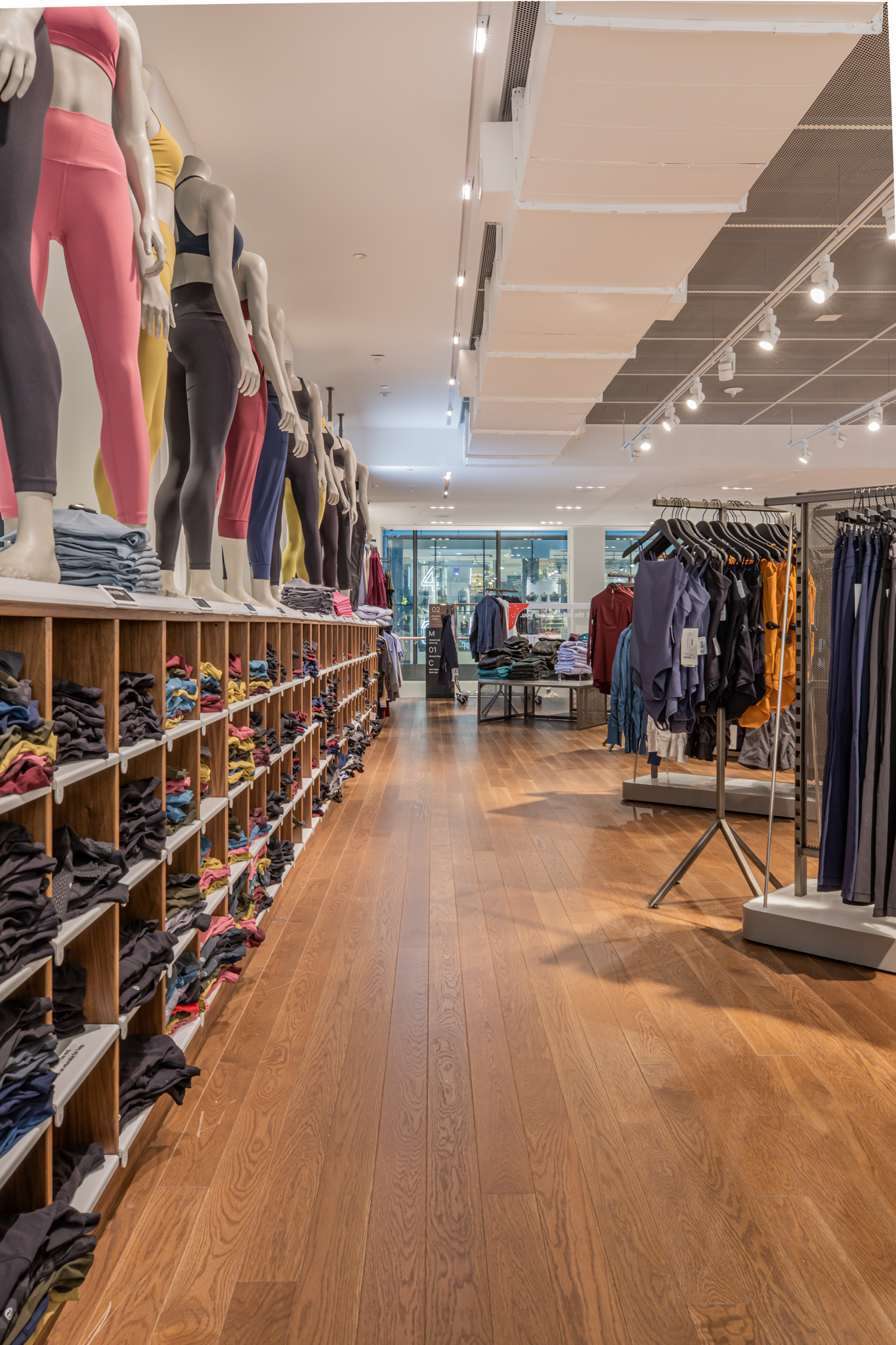 Custom wide-plank hardwood flooring at lululemon 5th Avenue showcasing PID Floors retail expertise