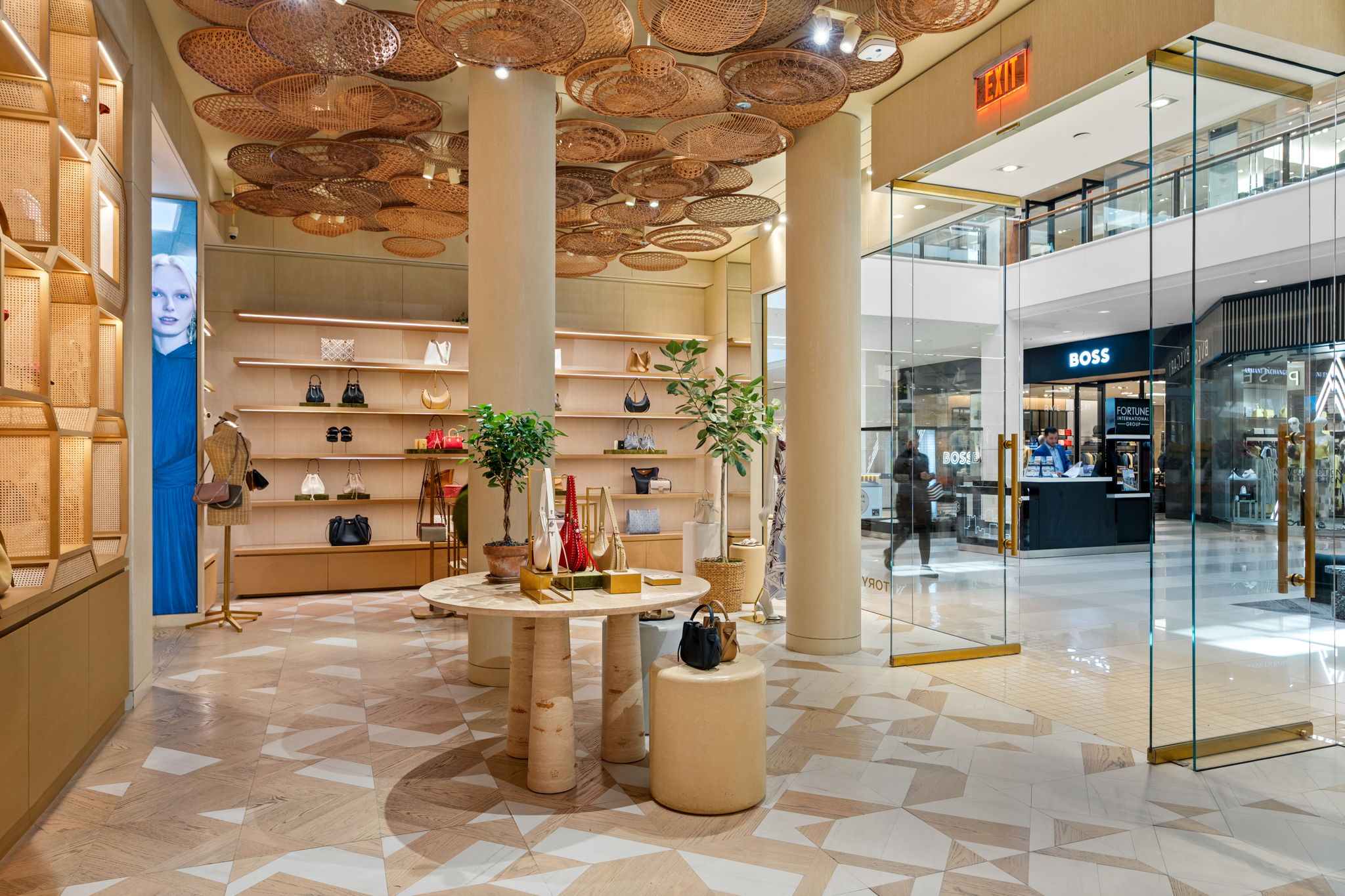 Tory Burch retail display with natural wood floor detail by PID Floors