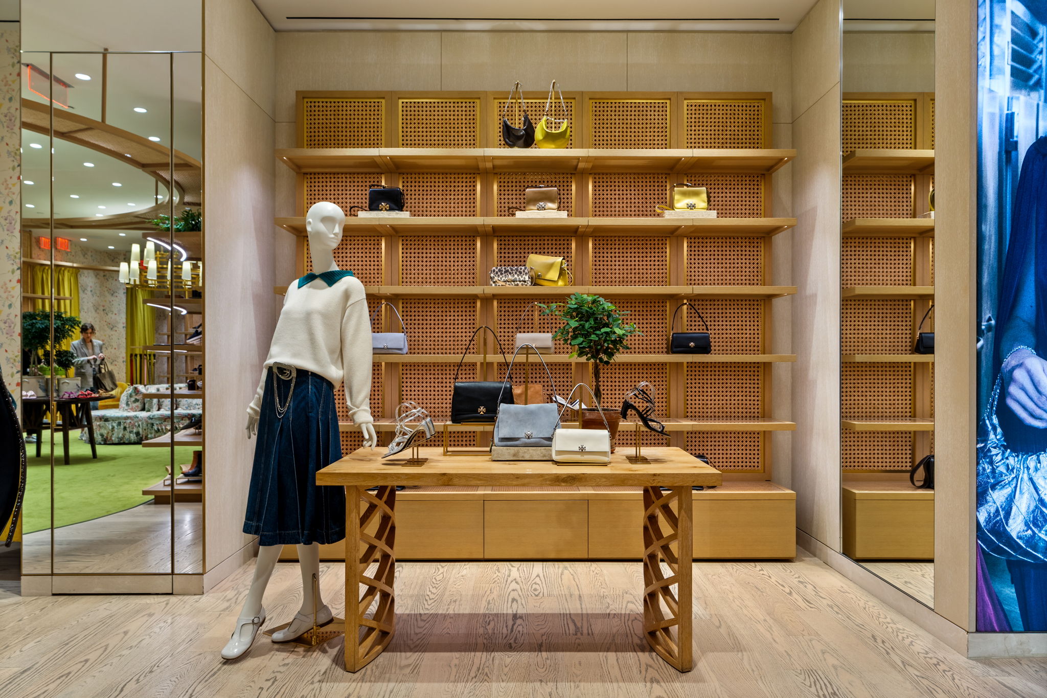 Floor-level detail of premium hardwood planks at Tory Burch Aventura location