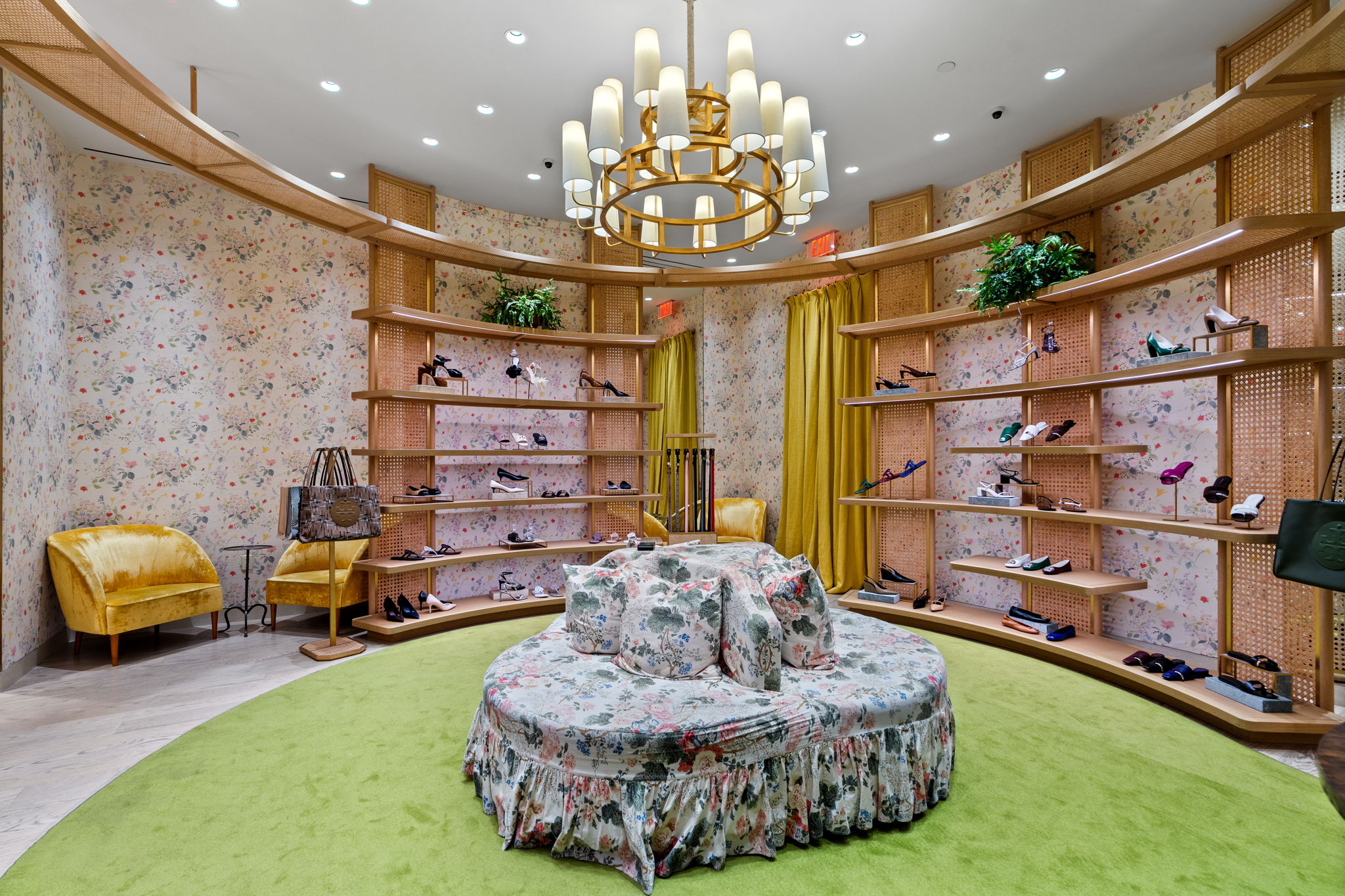 Bright retail interior of Tory Burch Aventura with seamless wood floor finish by PID Floors