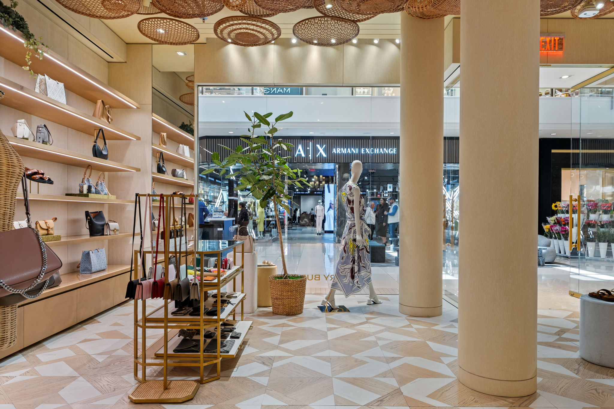 Full room view of Tory Burch Aventura Mall store with PID Floors luxury hardwood