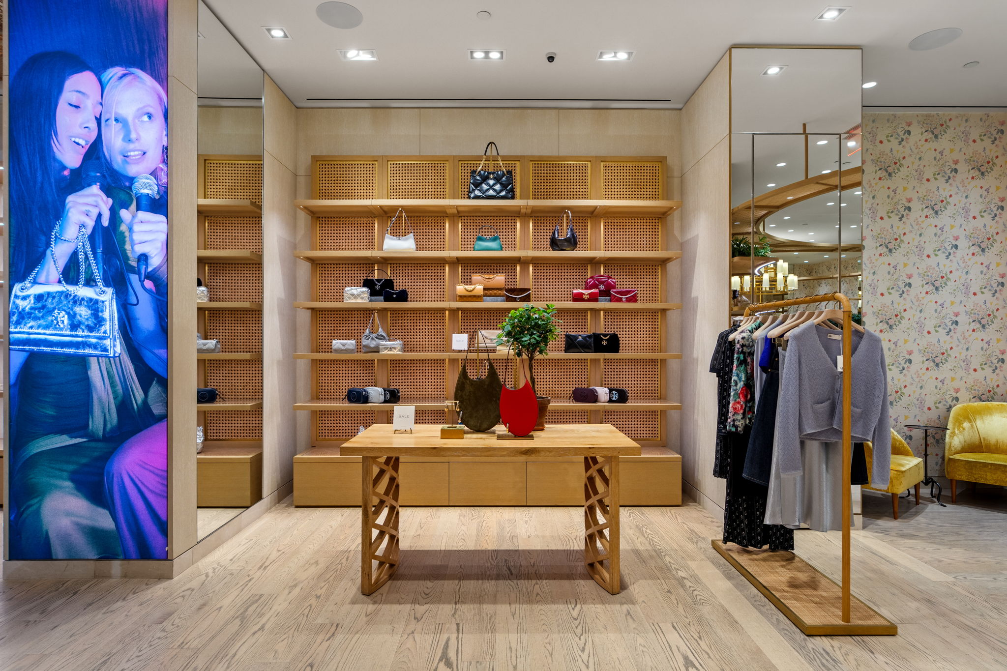 Side-angle view of Tory Burch Aventura boutique highlighting PID Floors installation