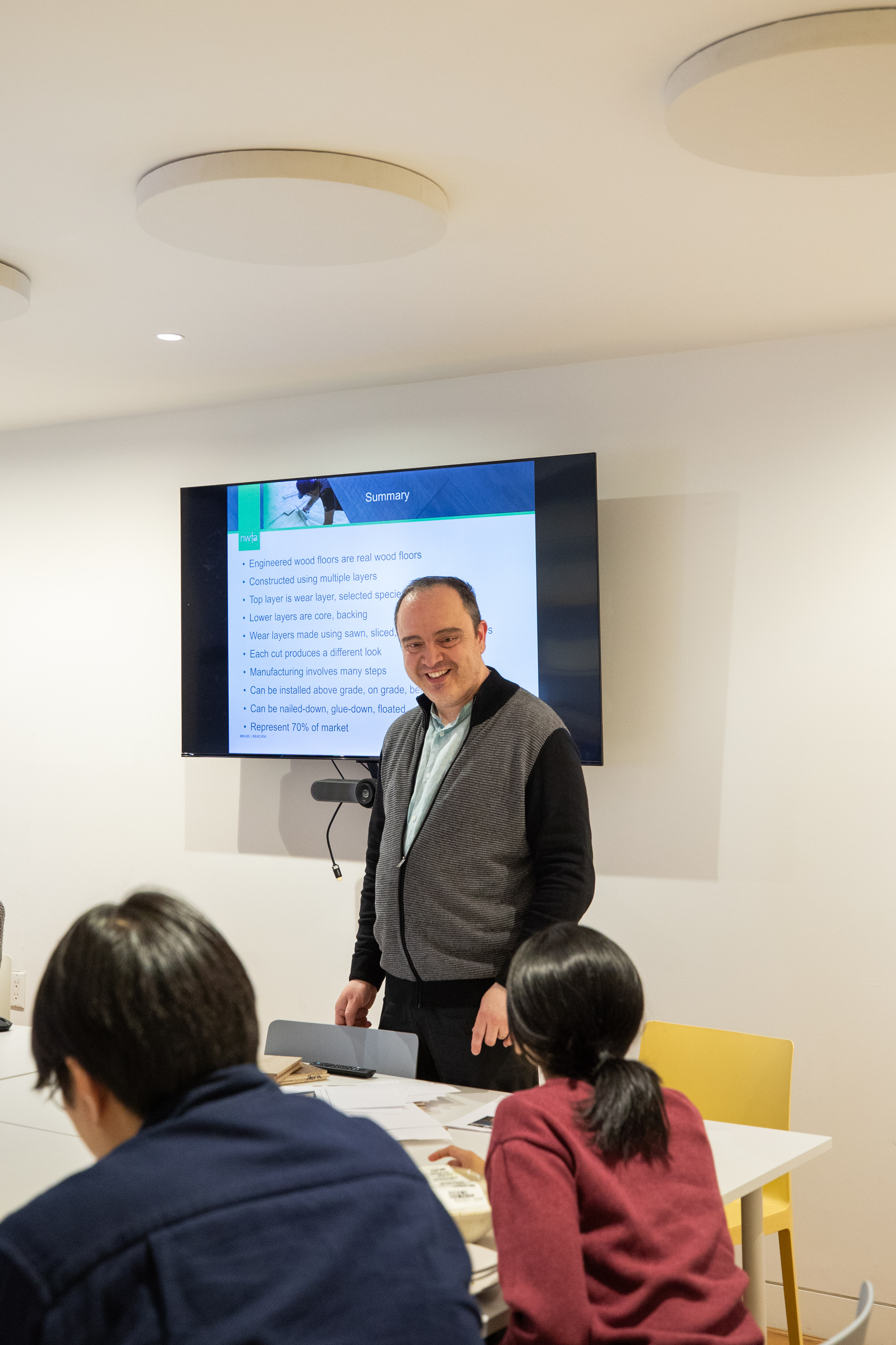 Speaker presenting flooring solutions for architects