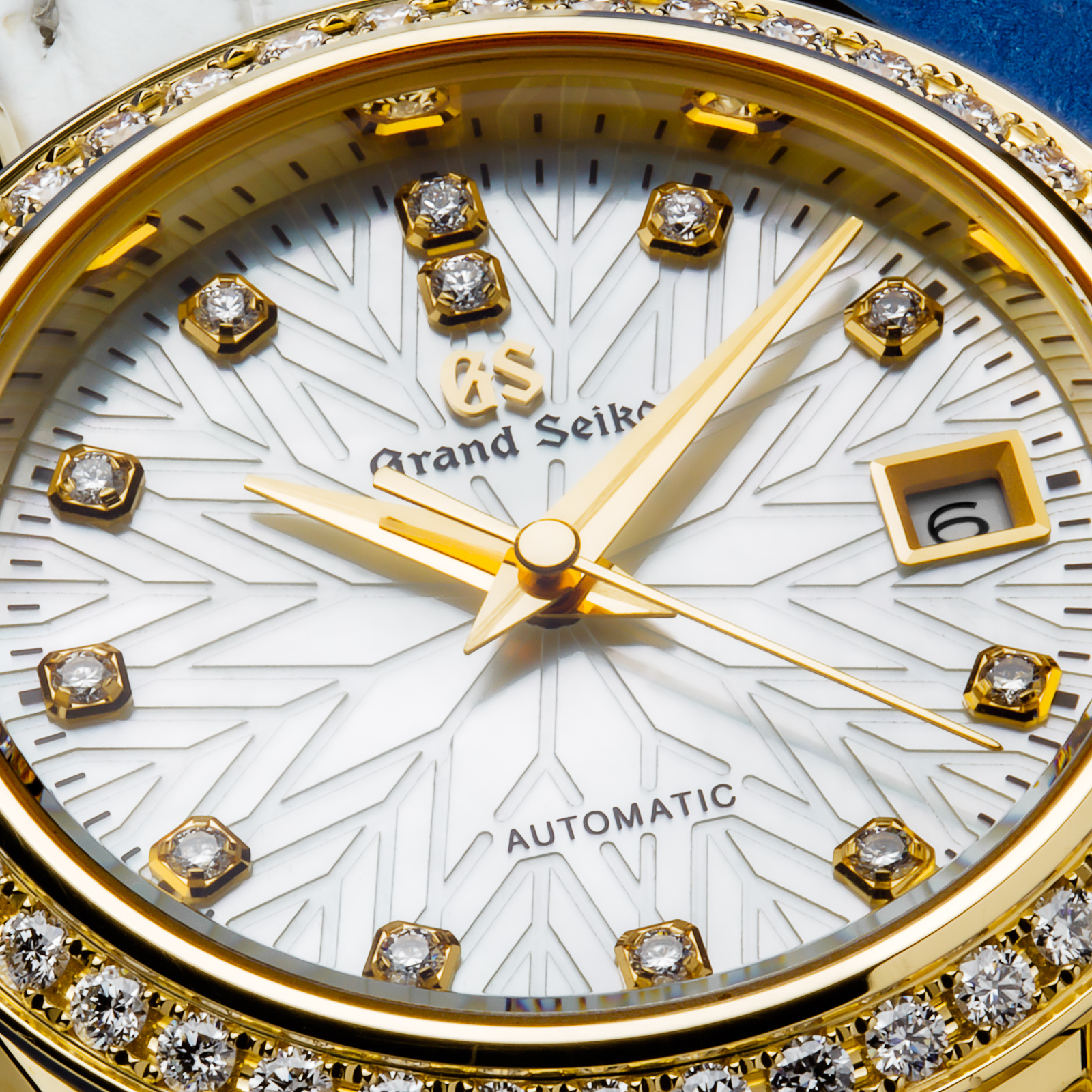 Grand Seiko wristwatch STGK004 - dial closeup showcasing the snowflake motif. 