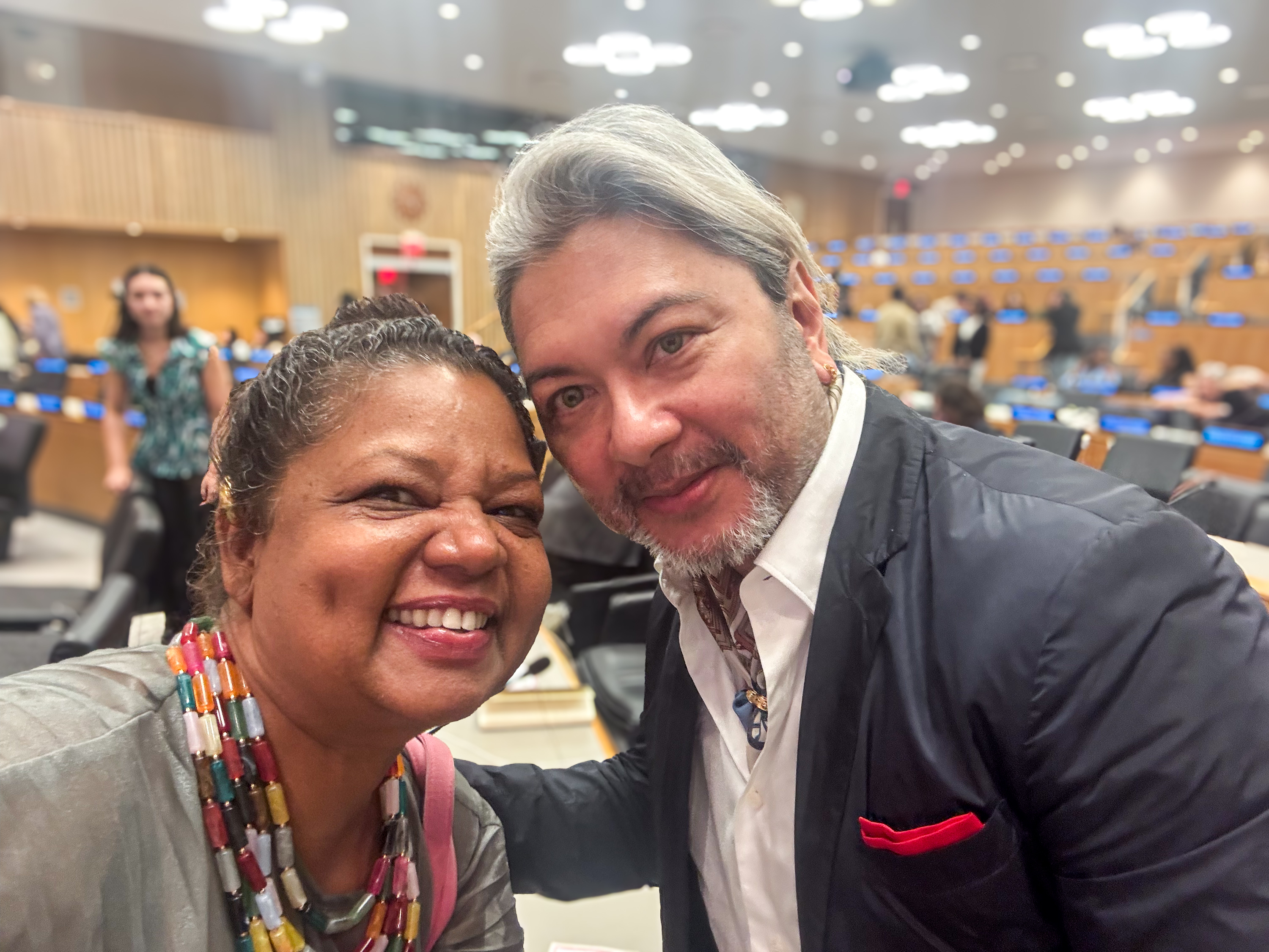 Architects, designers, and urban planning experts participating in regenerative community discussions at the UN