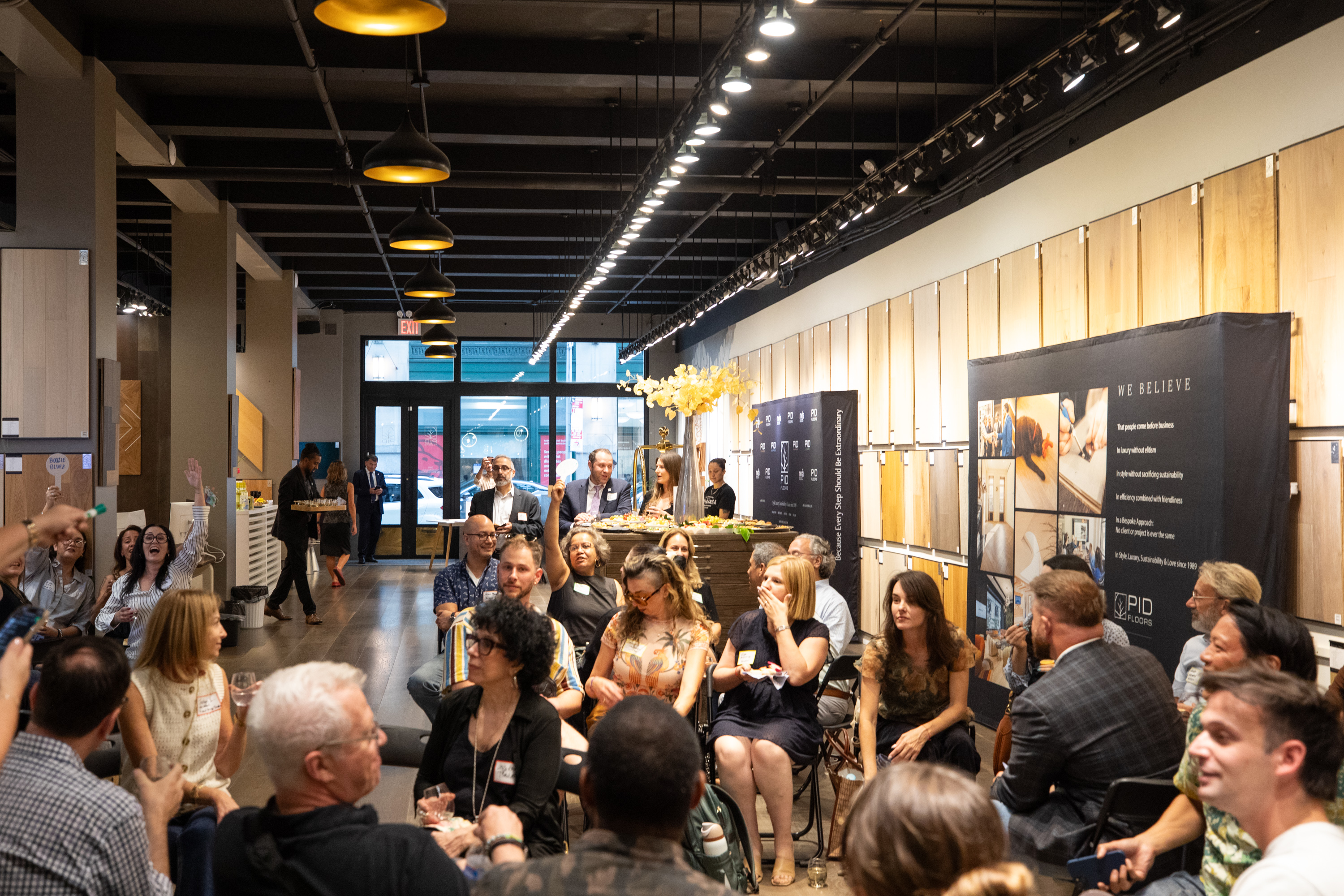 Contemporary hardwood flooring display during industry networking evening