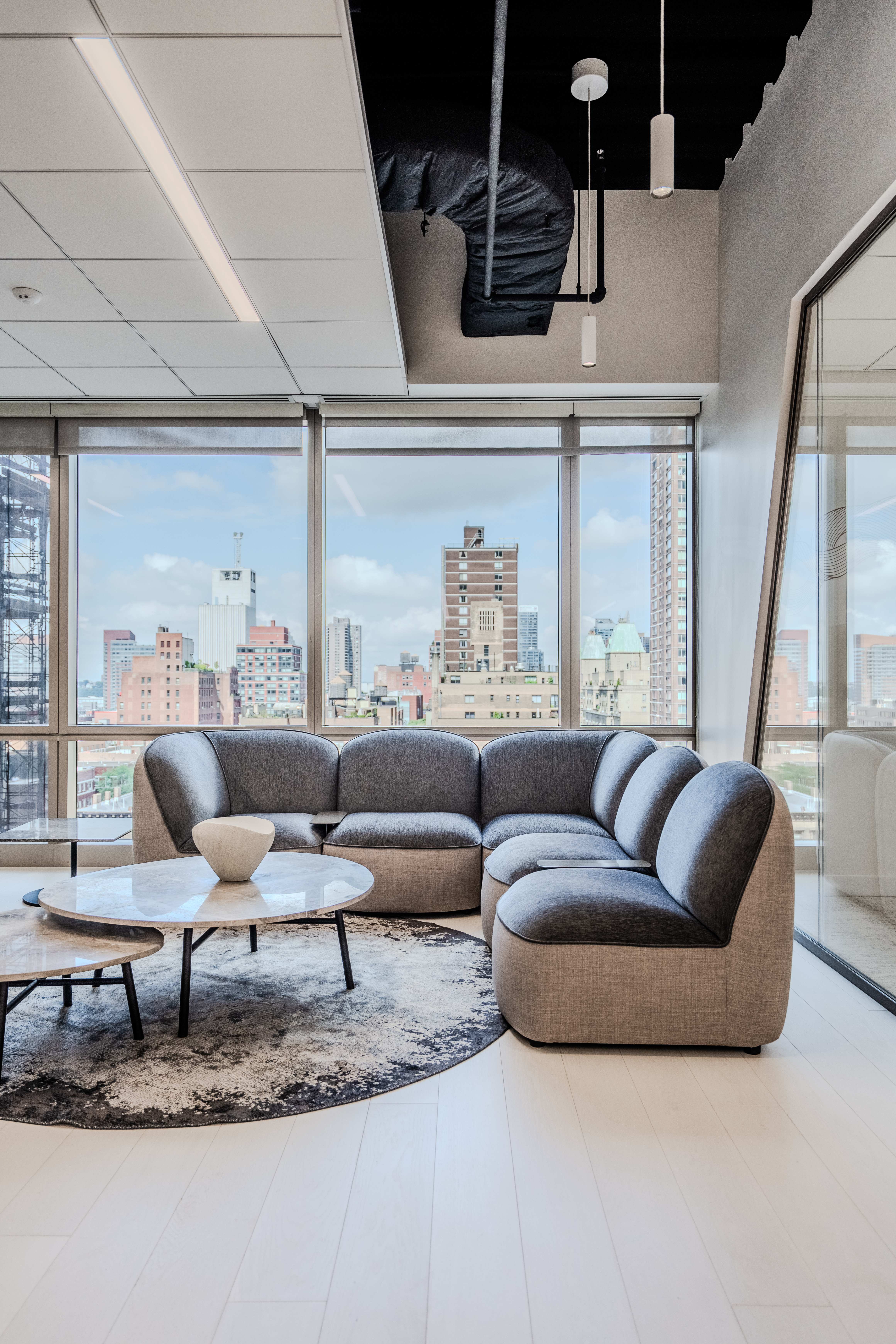Modern workplace with custom hardwood flooring installation and contemporary architectural design by PID Floors NYC