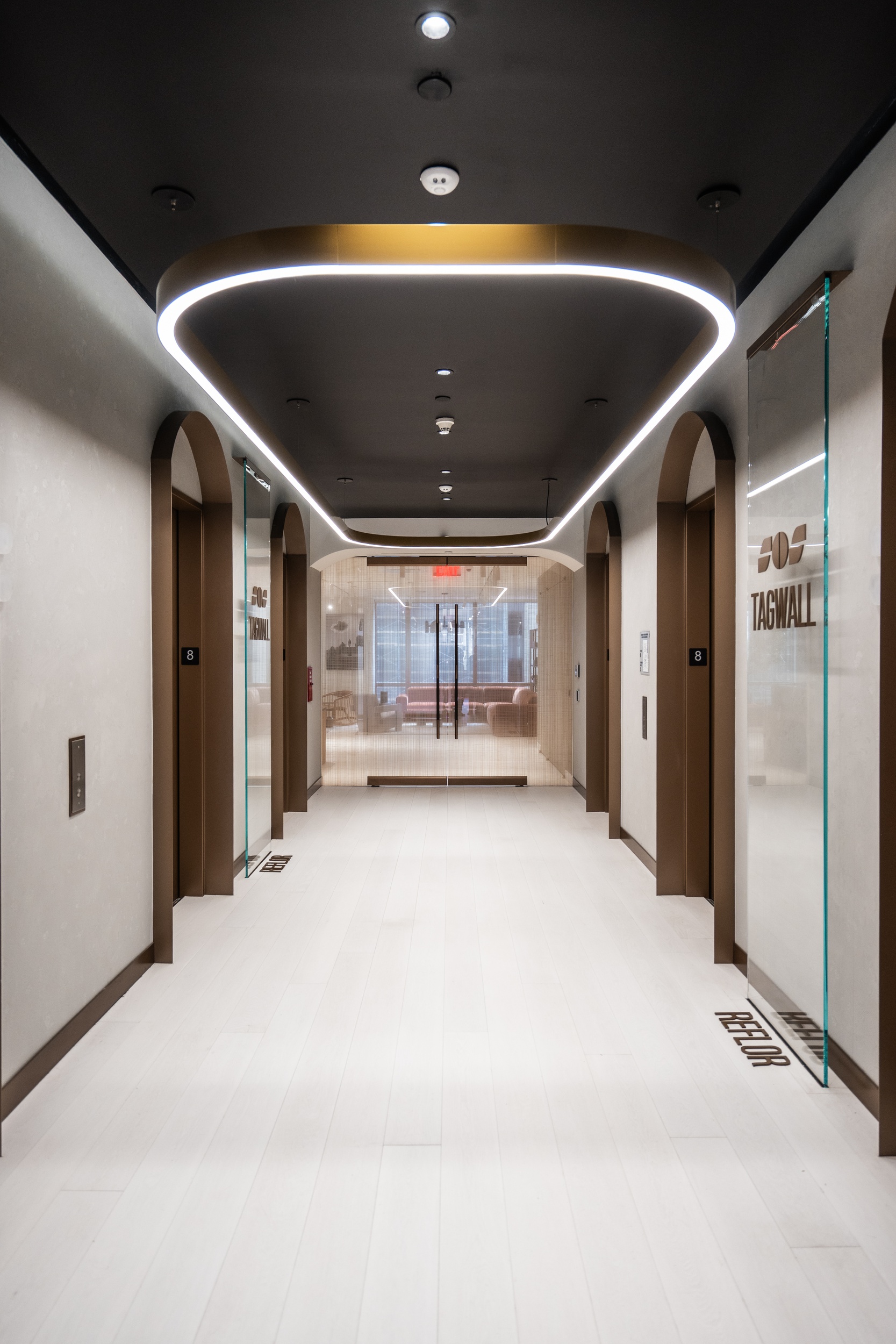 Contemporary workplace featuring commercial-grade hardwood flooring and modern architectural finishes