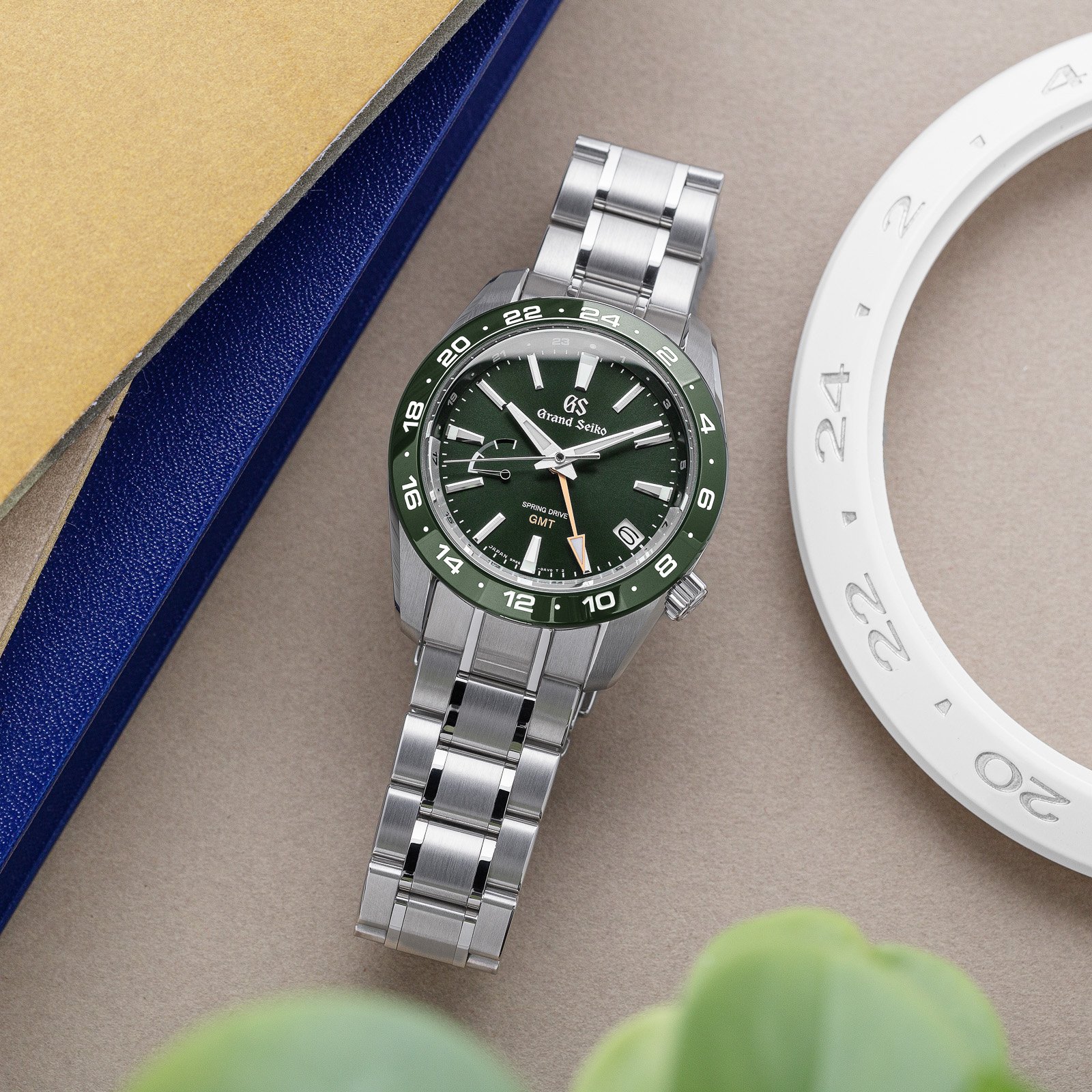 Grand Seiko SBGE257- a green dial, green ceramic bezel wristwatch on bracelet. 