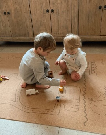 Toddlers playing on Pure Ears Collection mat