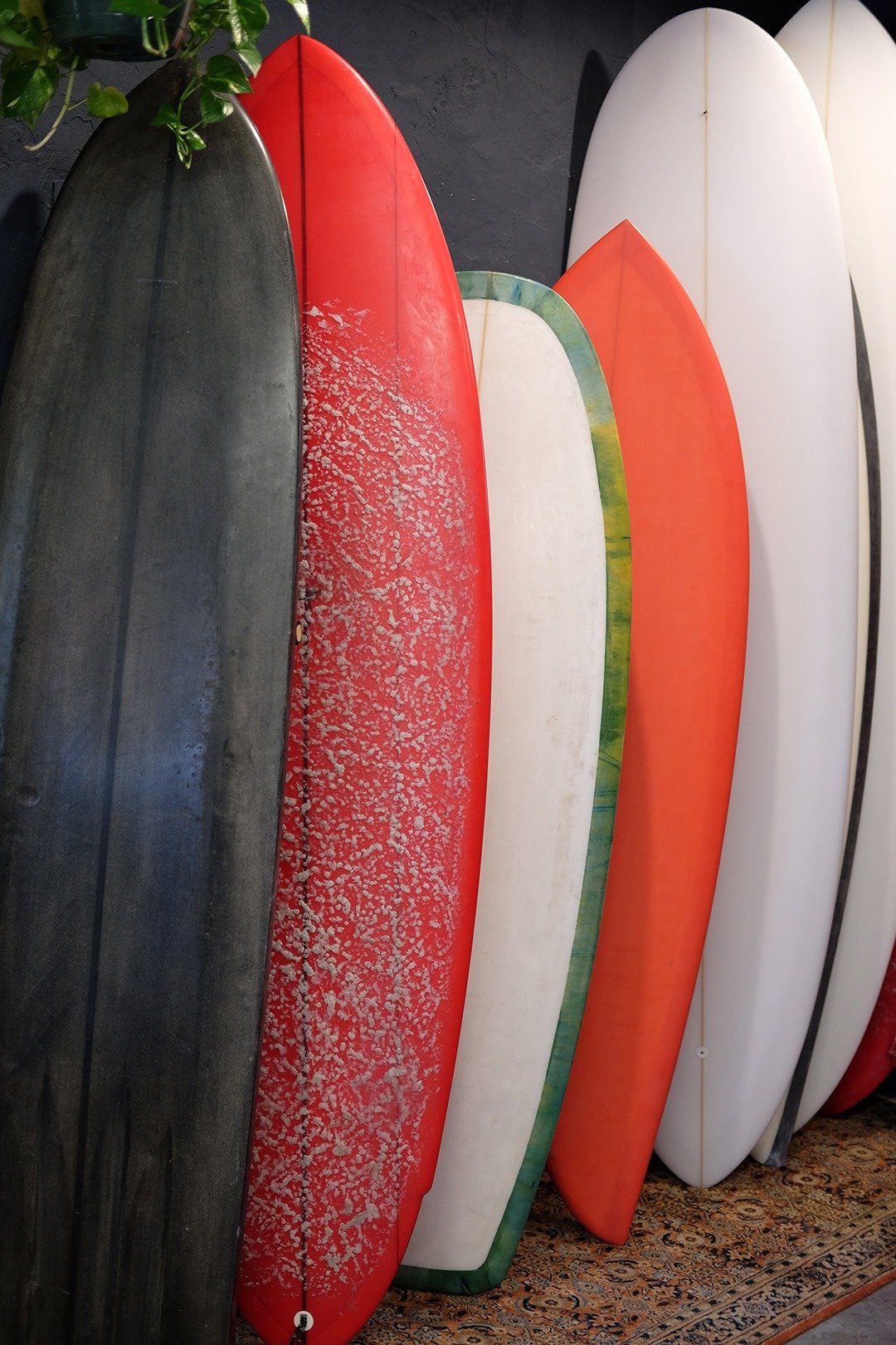 Some of Joe's latest surfboards on display.