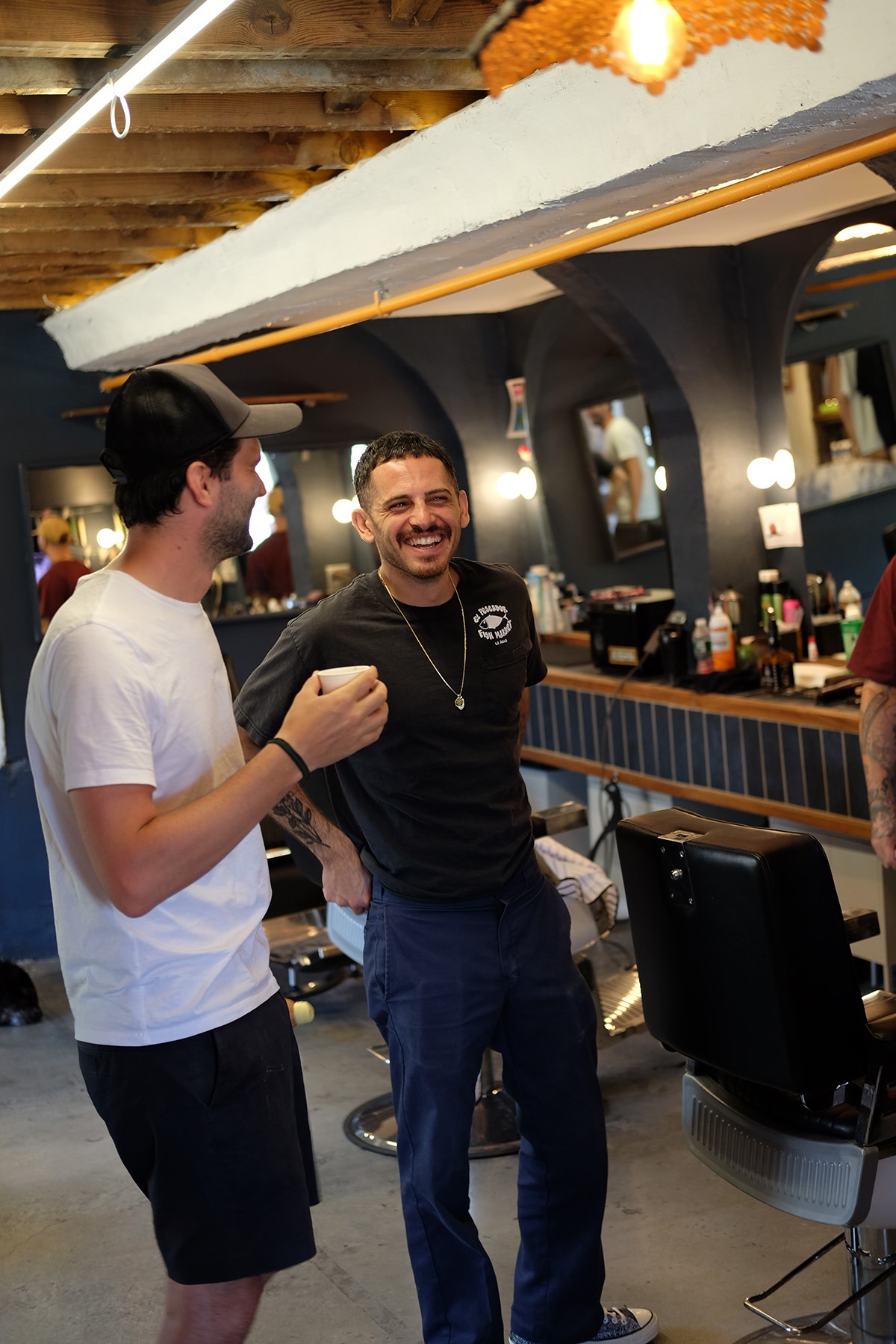 Joe Falcone chats with a customer in-between appointments.