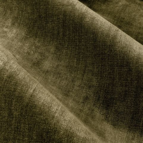A closeup image of velvet chenille curtain fabric in an earthy olive tone.