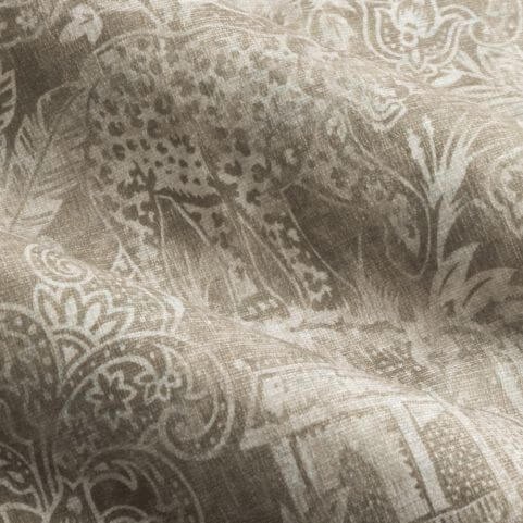A closeup image of chenille curtain fabric in a pale linen shade, featuring a contemporary exotic design of Bengal tigers and jungle foliage.