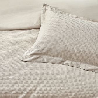 A boho-style duvet cover set with a textured waffle weave design.