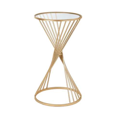 a gold side table in a twisted hourglass shape and a glass top. 