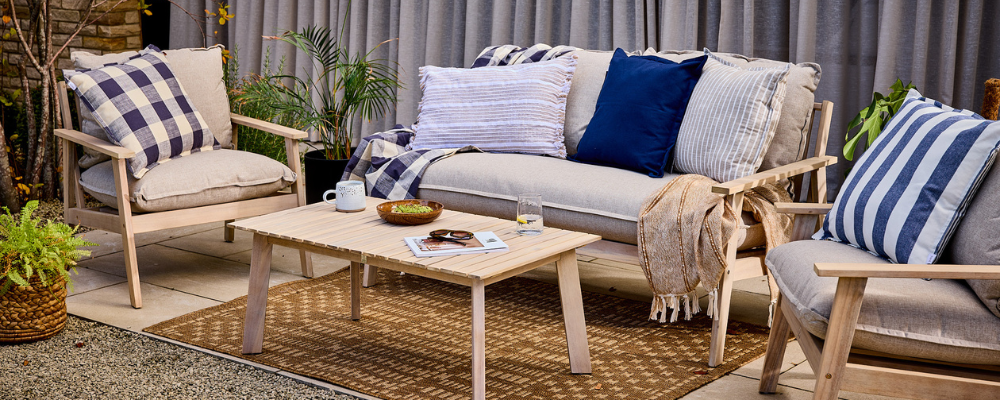 An outdoor area with various outdoor cushions