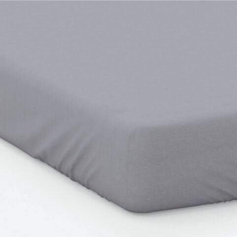 A grey cotton percale fitted bed sheet placed over a mattress on a white bed frame.