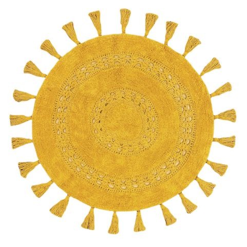 A round yellow bath mat with a woven mandala design and textured tassels that run around the border.