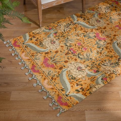 Charais 120x180cm indoor Rug in Yellow on hardwood floors next to a chair