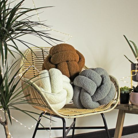 knot fleece minimalist cushions on chair