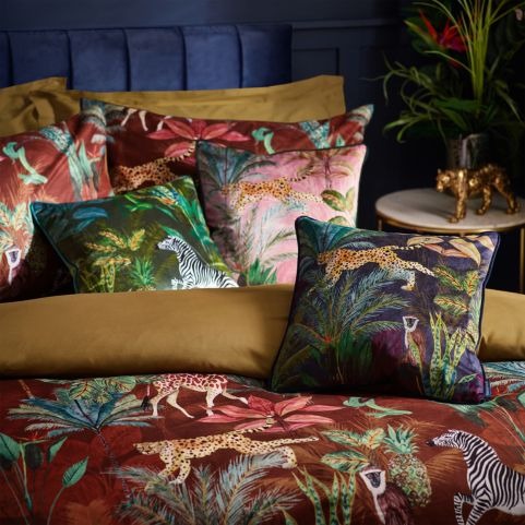 close up of exotic animal velvet duvet cover set in bedroom with navy wall