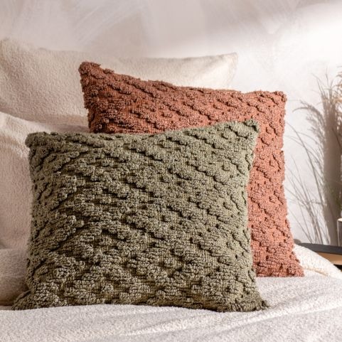 two sandi style cushions in olive and rust